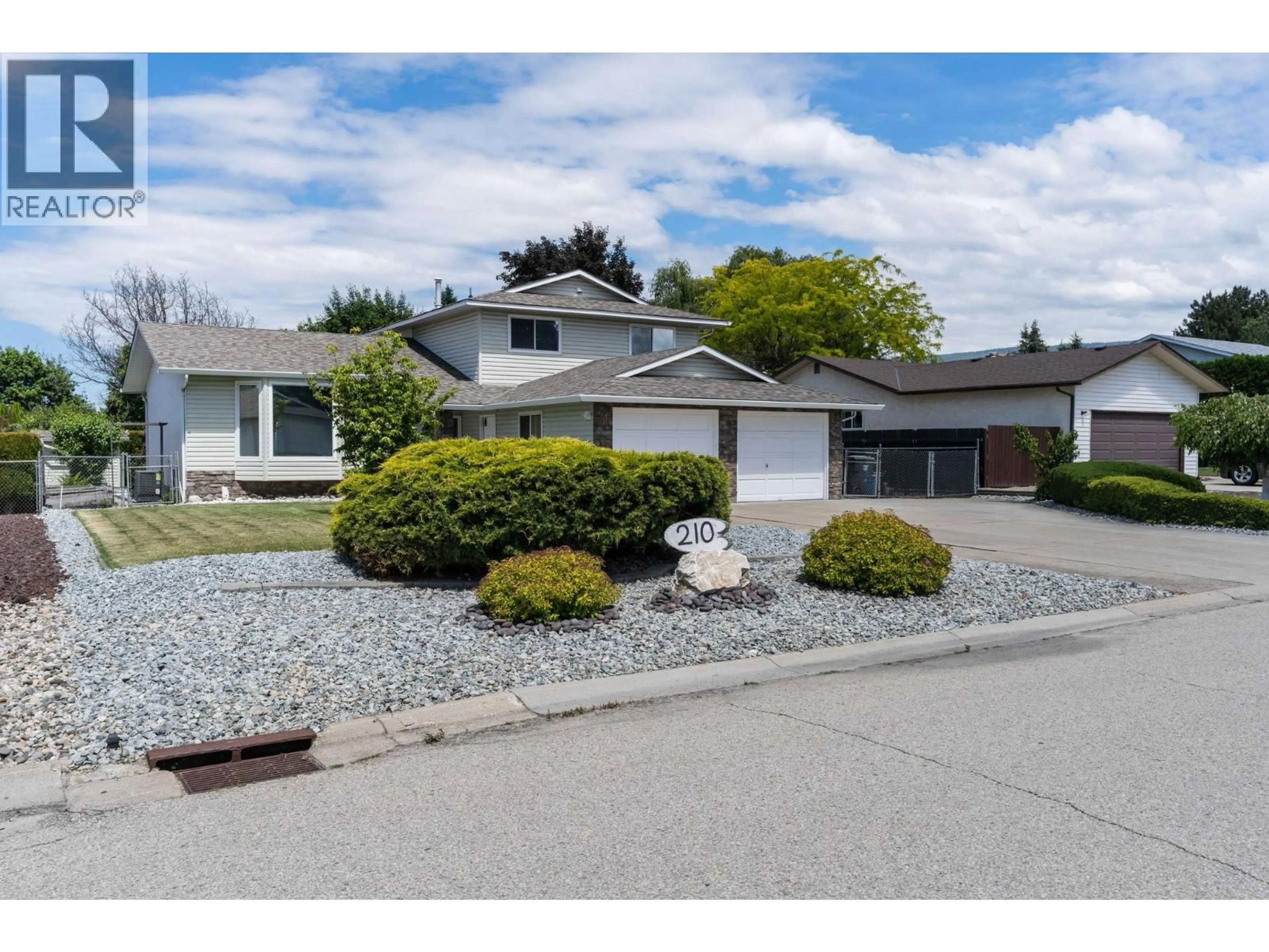 Home with vinyl exterior material, street for 210 FELIX ROAD, Kelowna British Columbia V1X7C9