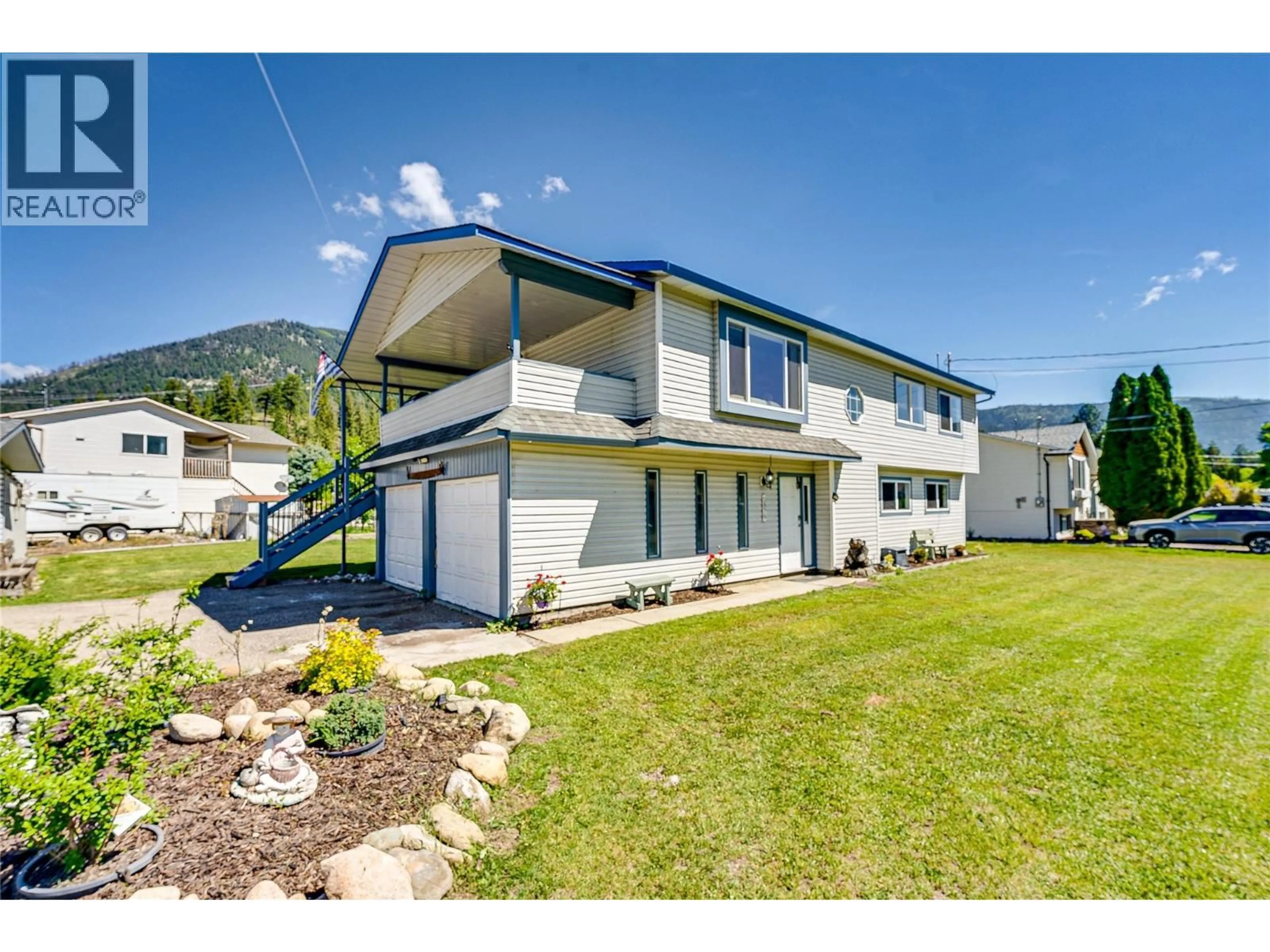A pic from outside/outdoor area/front of a property/back of a property/a pic from drone, mountain view for 5876 WESTWYND DRIVE, Falkland British Columbia V0E1W0