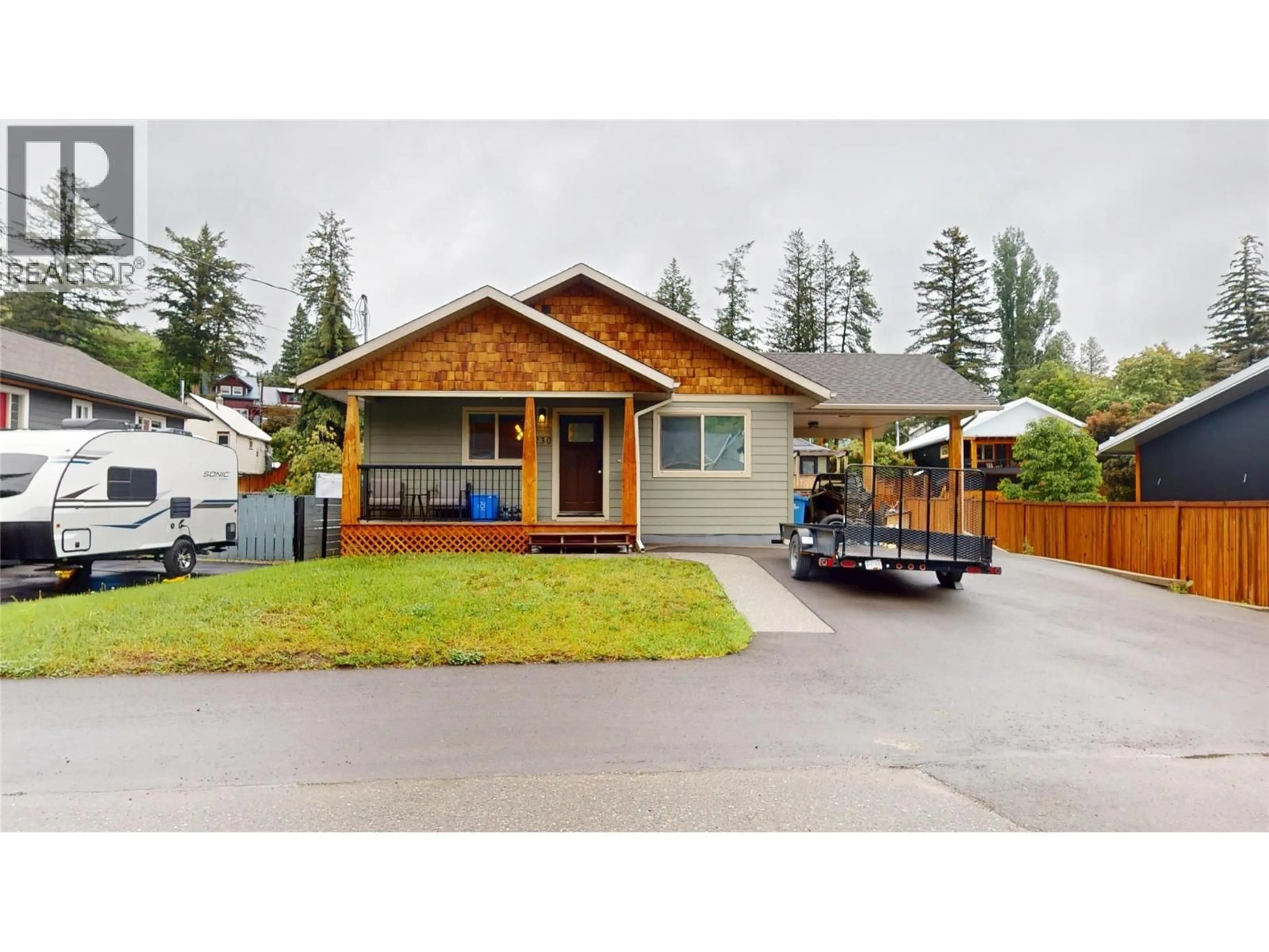 Home with vinyl exterior material, street for 230 303 AVENUE, Kimberley British Columbia V1A3G5