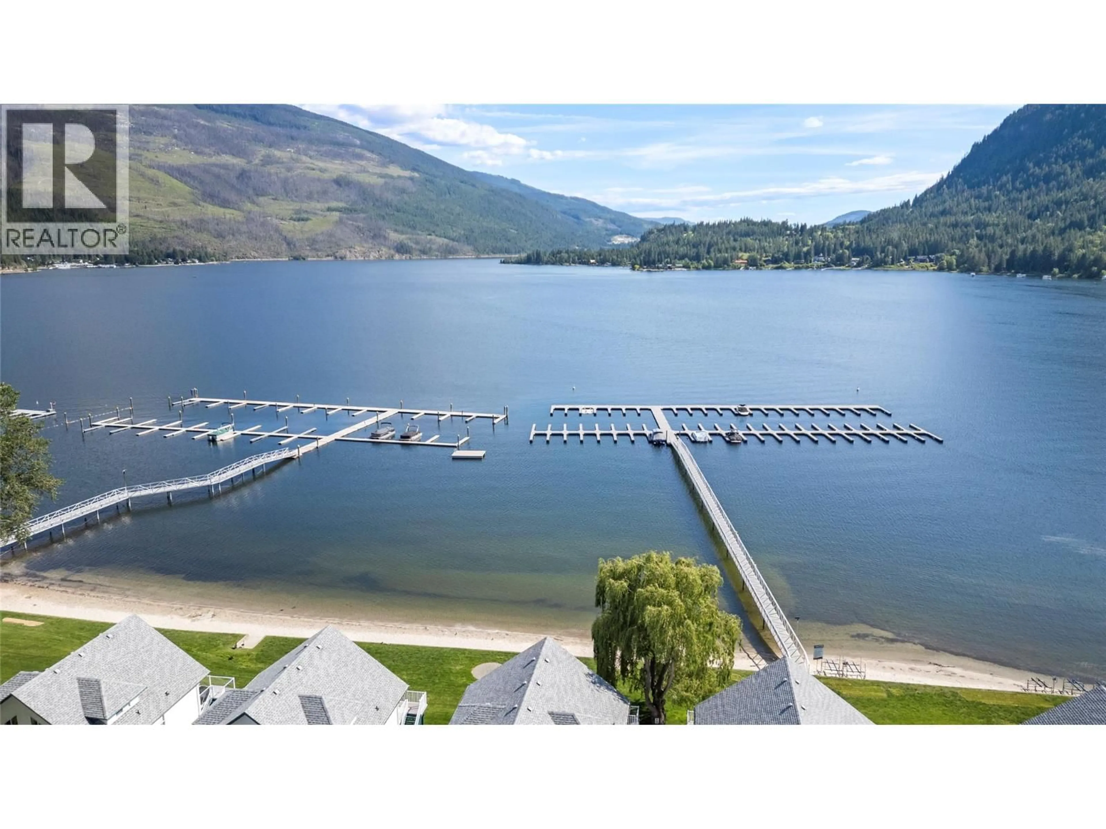 A pic from outside/outdoor area/front of a property/back of a property/a pic from drone, water/lake/river/ocean view for 243 - 213 WHITE PINE CRESCENT, Sicamous British Columbia V0E2V1