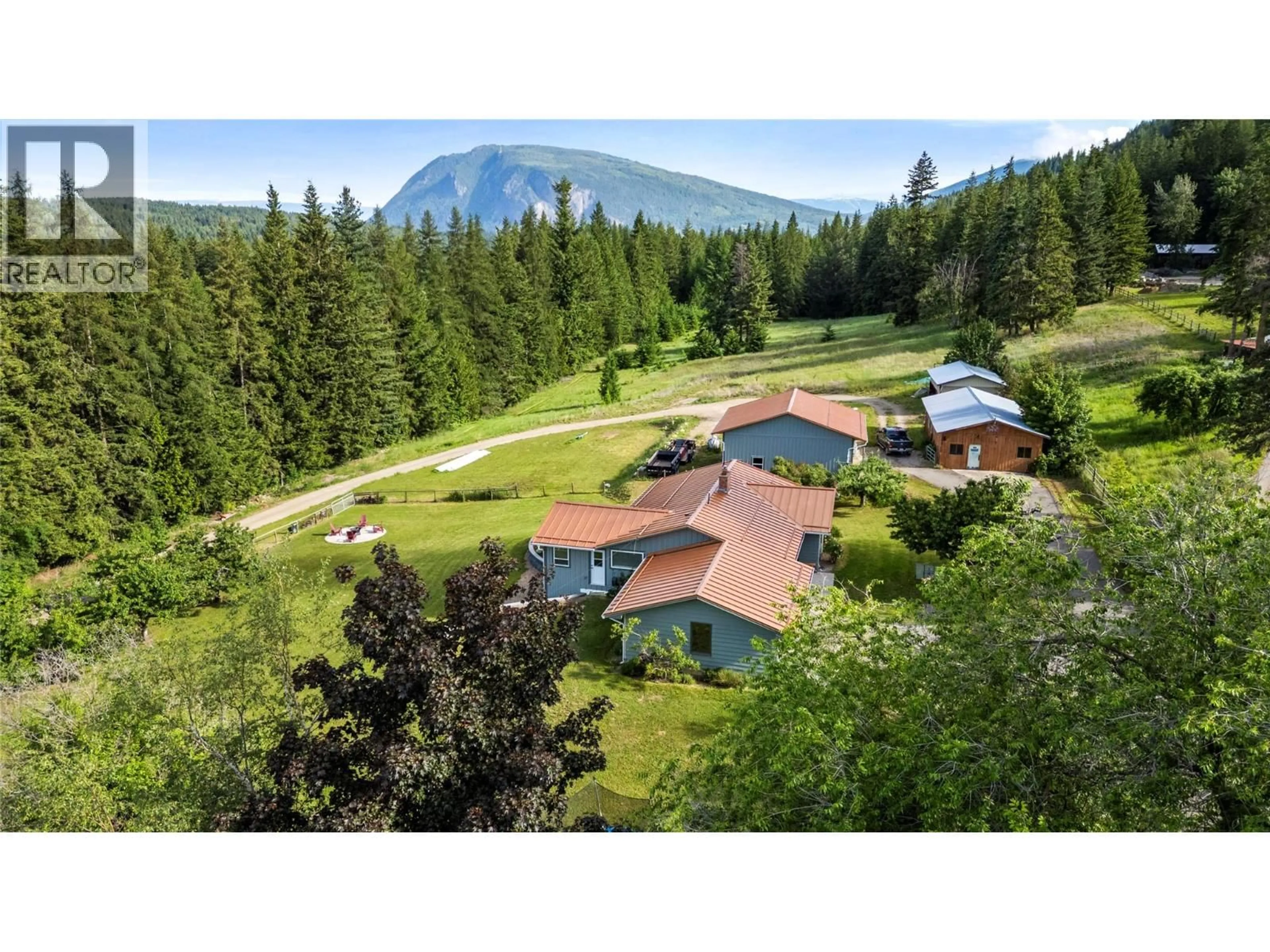 A pic from outside/outdoor area/front of a property/back of a property/a pic from drone, mountain view for 5851 20 AVENUE NORTHEAST, Salmon Arm British Columbia V1E1Y4