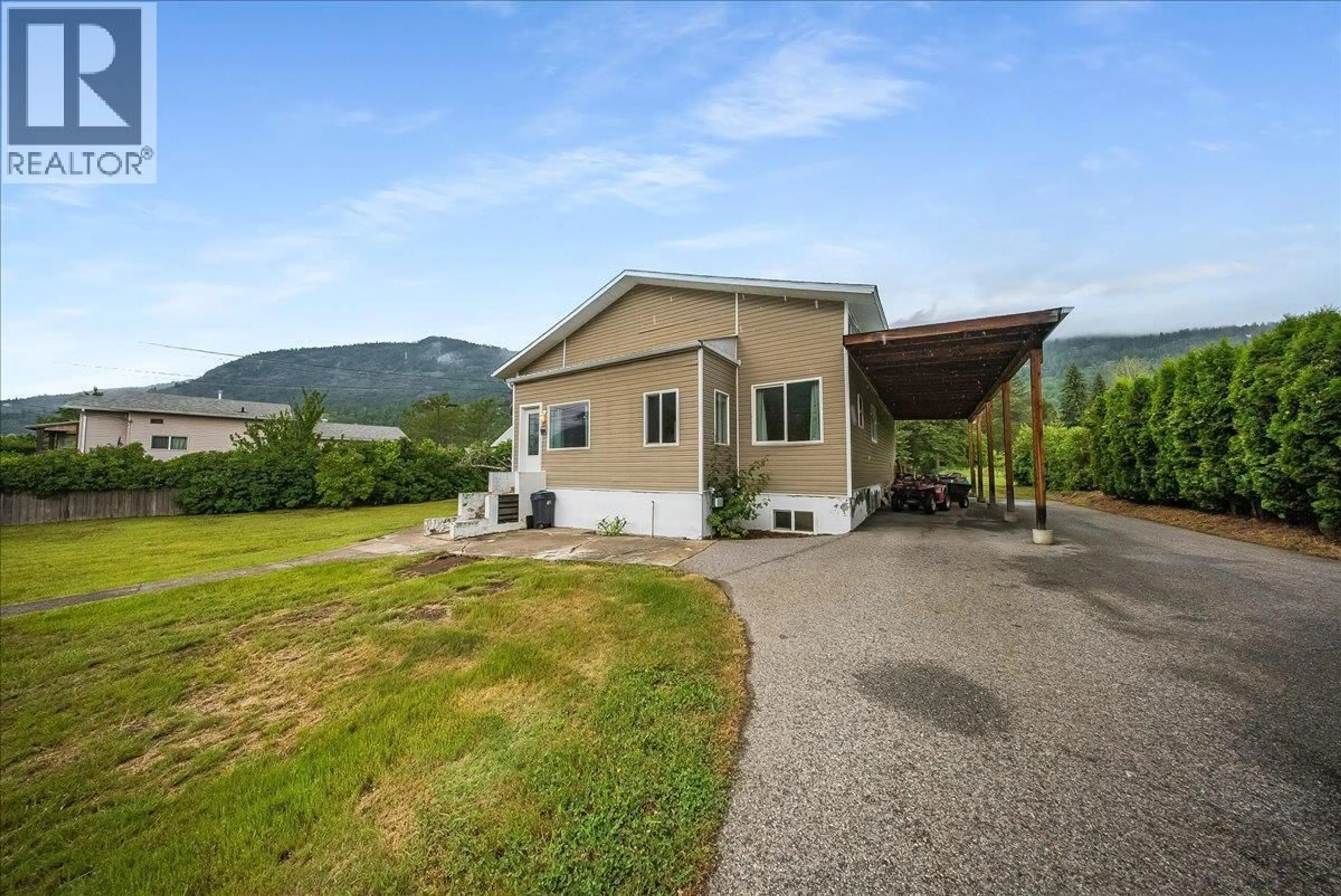 A pic from outside/outdoor area/front of a property/back of a property/a pic from drone, mountain view for 309 12TH AVENUE, Genelle British Columbia V0G1G0
