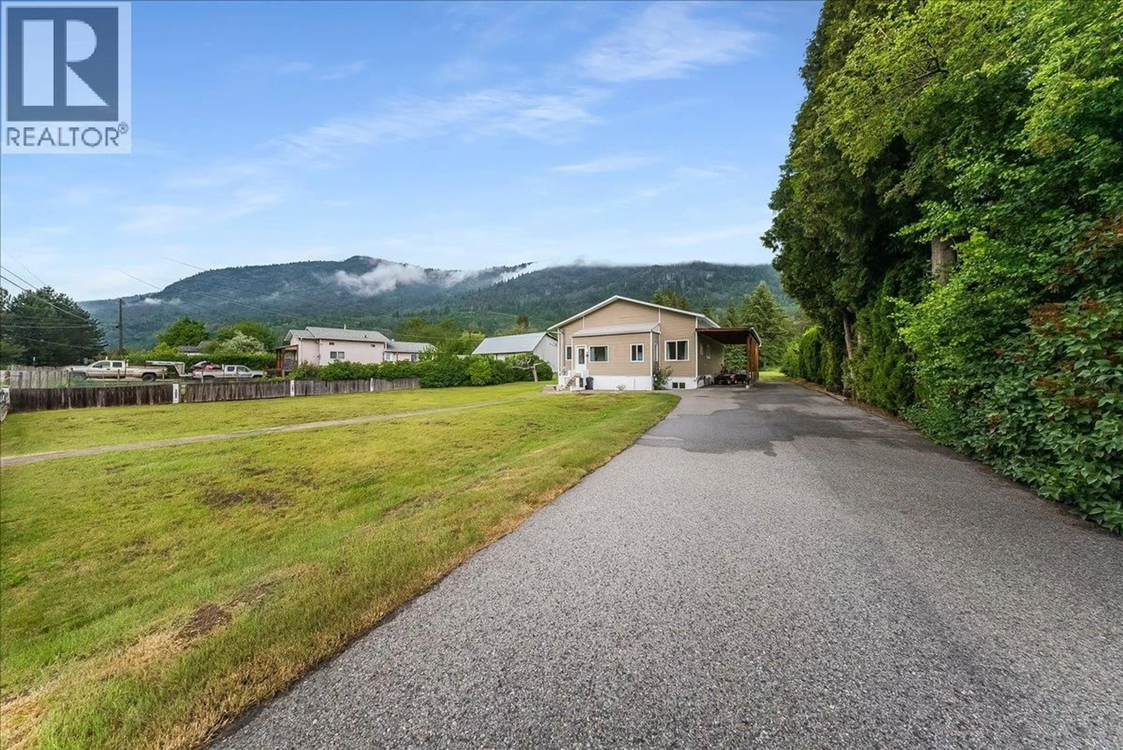 A pic from outside/outdoor area/front of a property/back of a property/a pic from drone, mountain view for 309 12TH AVENUE, Genelle British Columbia V0G1G0