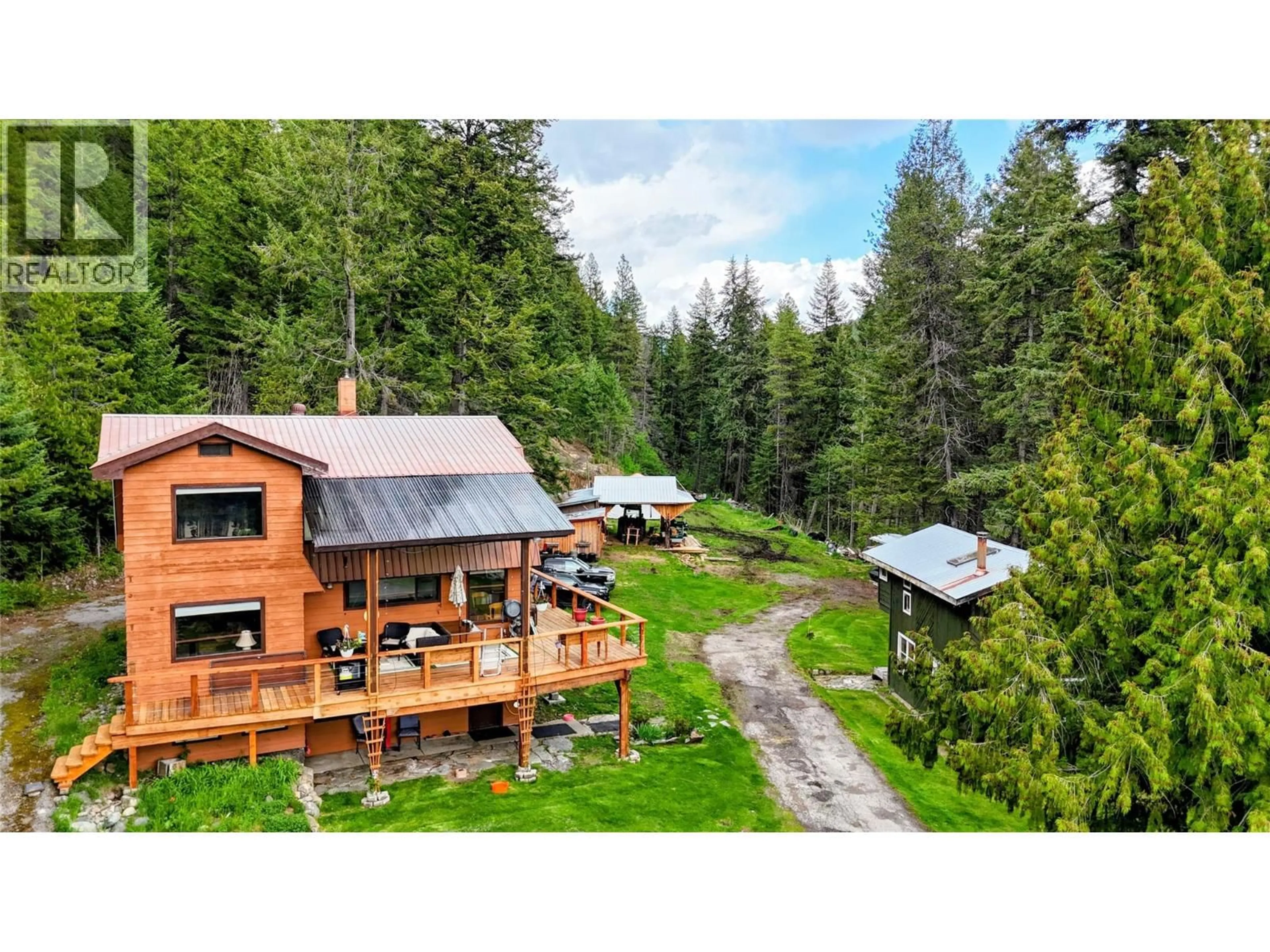 A pic from outside/outdoor area/front of a property/back of a property/a pic from drone, forest/trees view for 1525 HIGHWAY 3 / 95 HIGHWAY, Yahk British Columbia V0B2P0