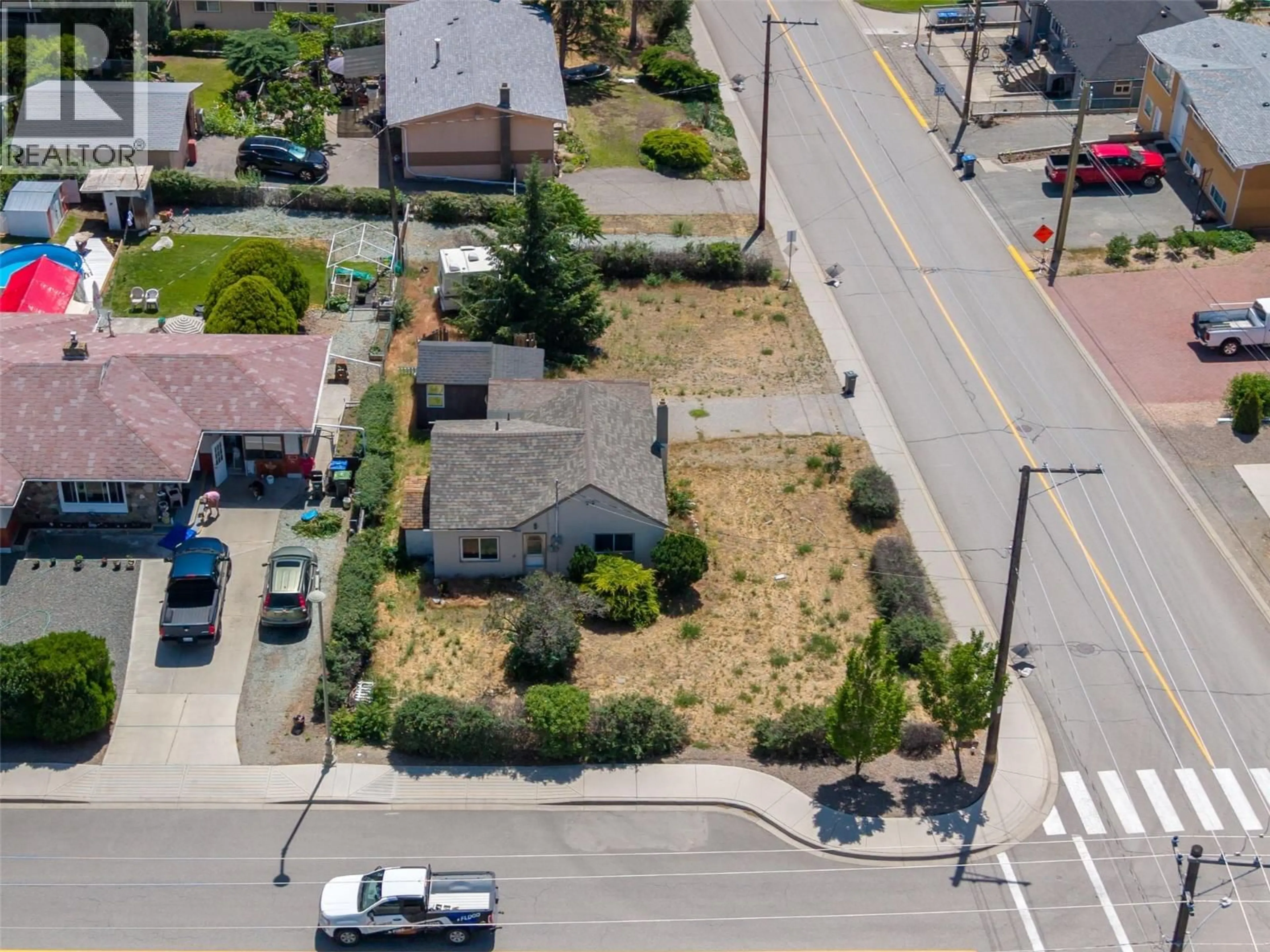 A pic from outside/outdoor area/front of a property/back of a property/a pic from drone, street for 8709 74TH AVENUE, Osoyoos British Columbia V0H1V0
