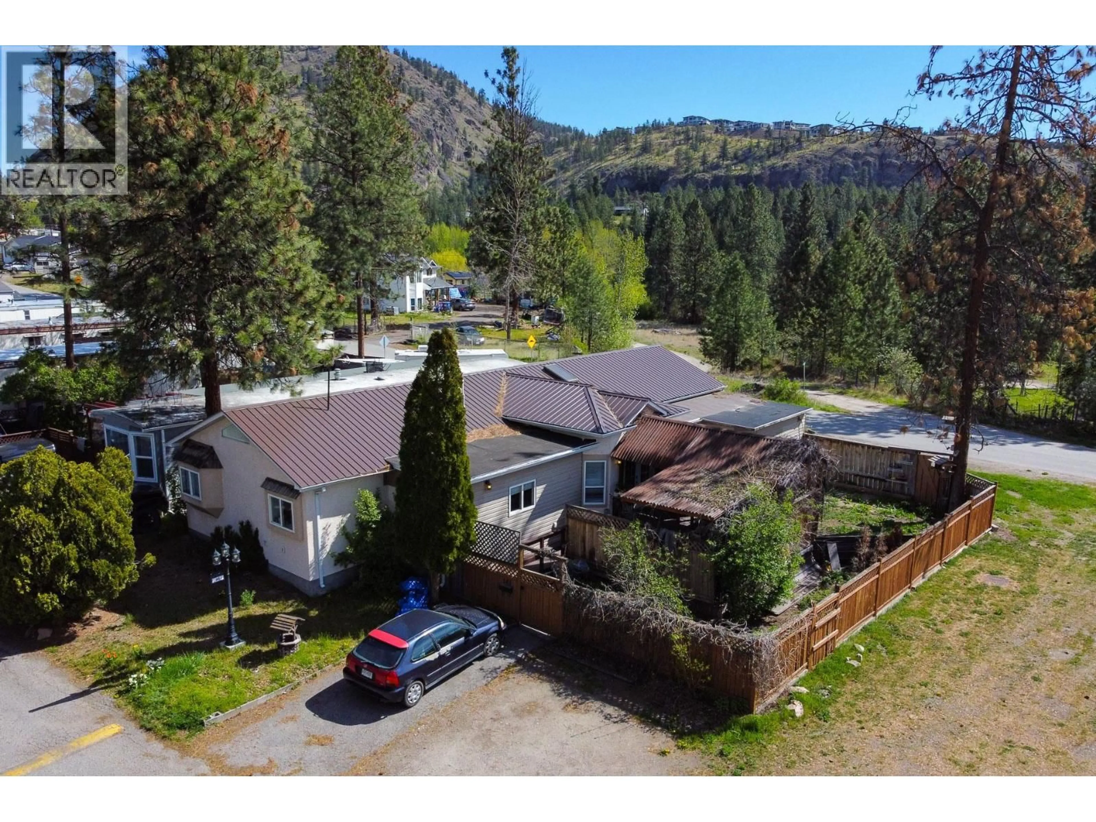 A pic from outside/outdoor area/front of a property/back of a property/a pic from drone, mountain view for 145 - 1999 HIGHWAY 97 OTHER SOUTH, West Kelowna British Columbia V1Z1B2