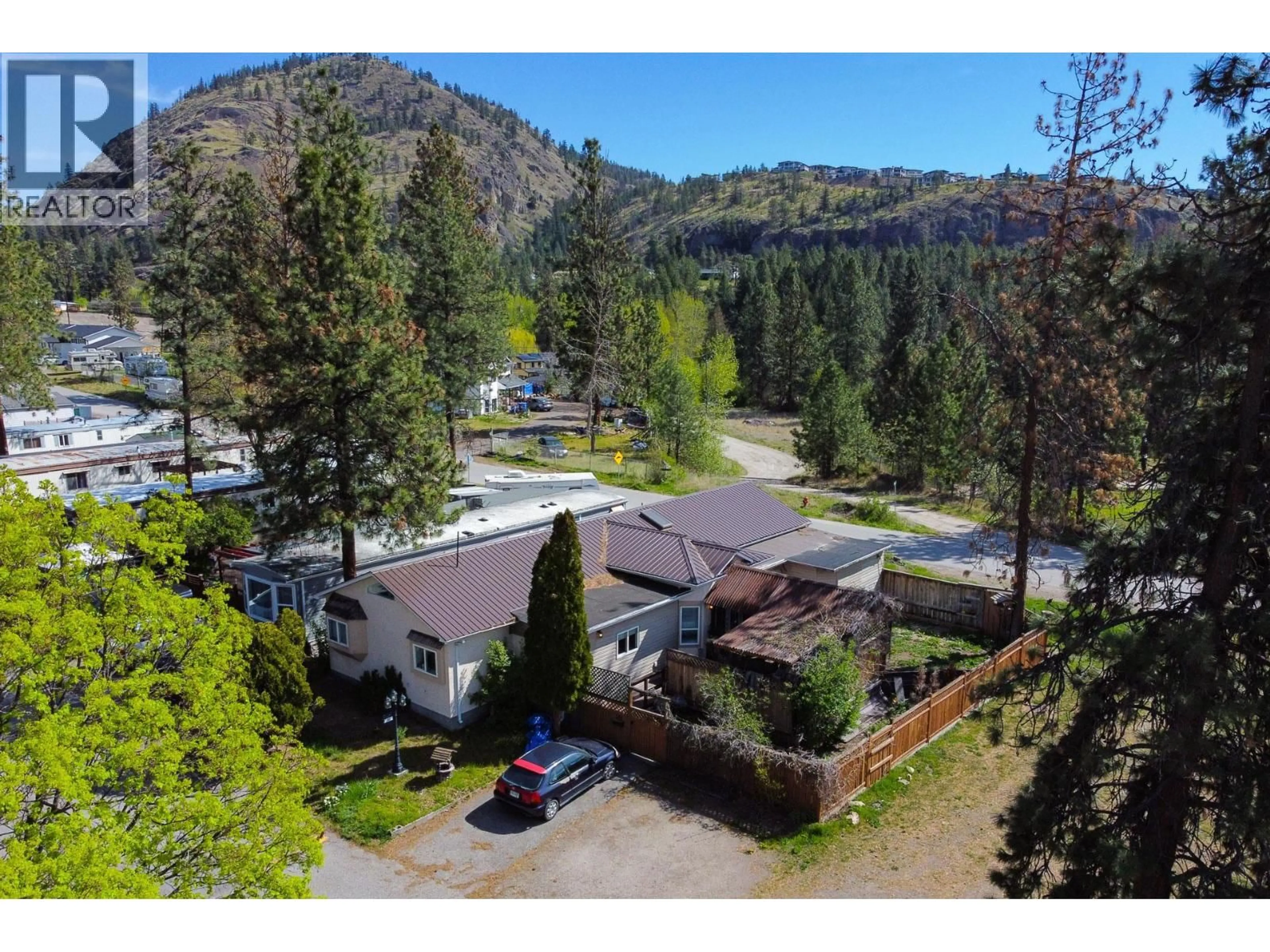 A pic from outside/outdoor area/front of a property/back of a property/a pic from drone, mountain view for 145 - 1999 HIGHWAY 97 OTHER SOUTH, West Kelowna British Columbia V1Z1B2
