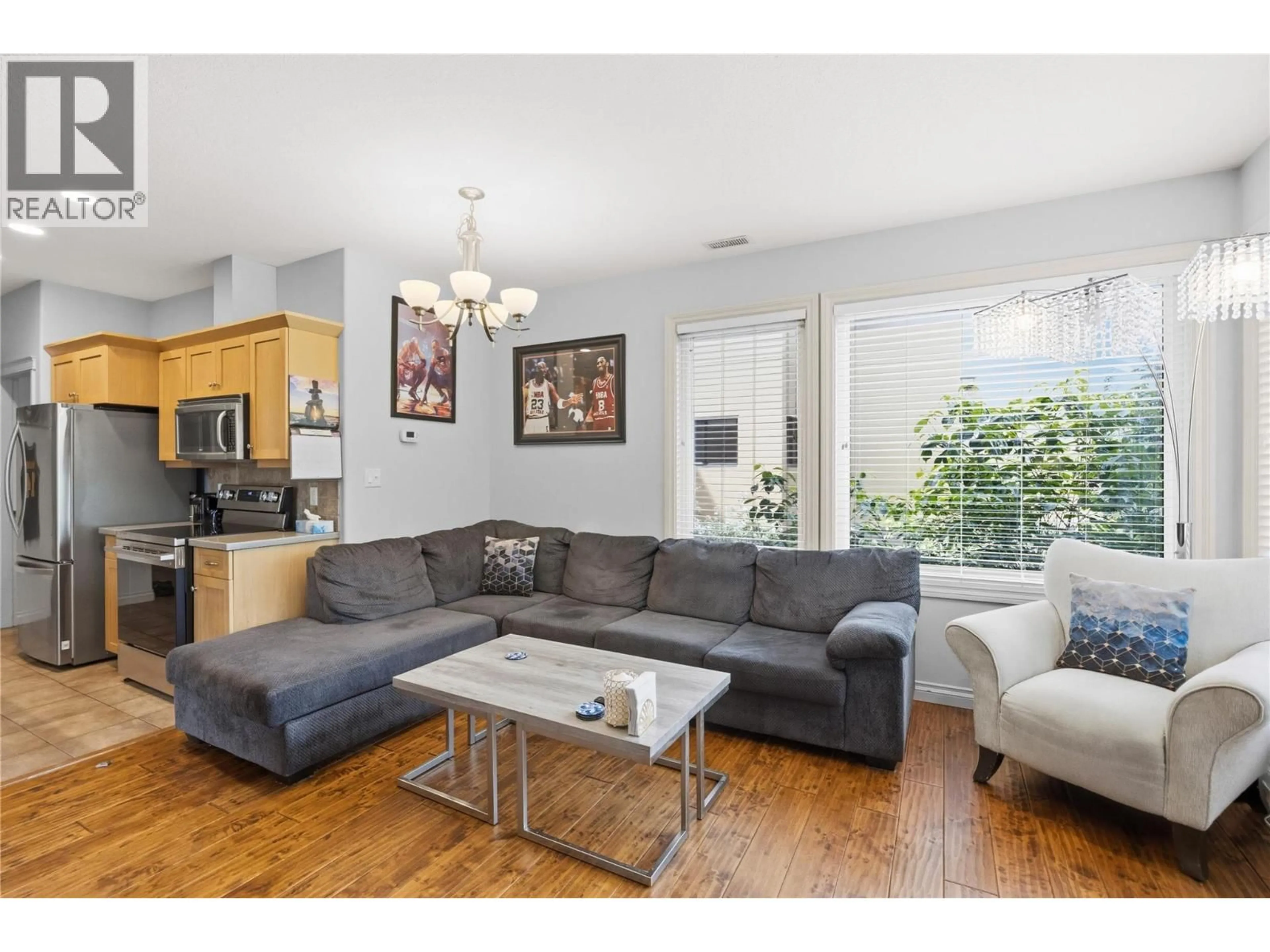 Living room with furniture, wood/laminate floor for 201 - 3311 WILSON STREET, Penticton British Columbia V2A8J3