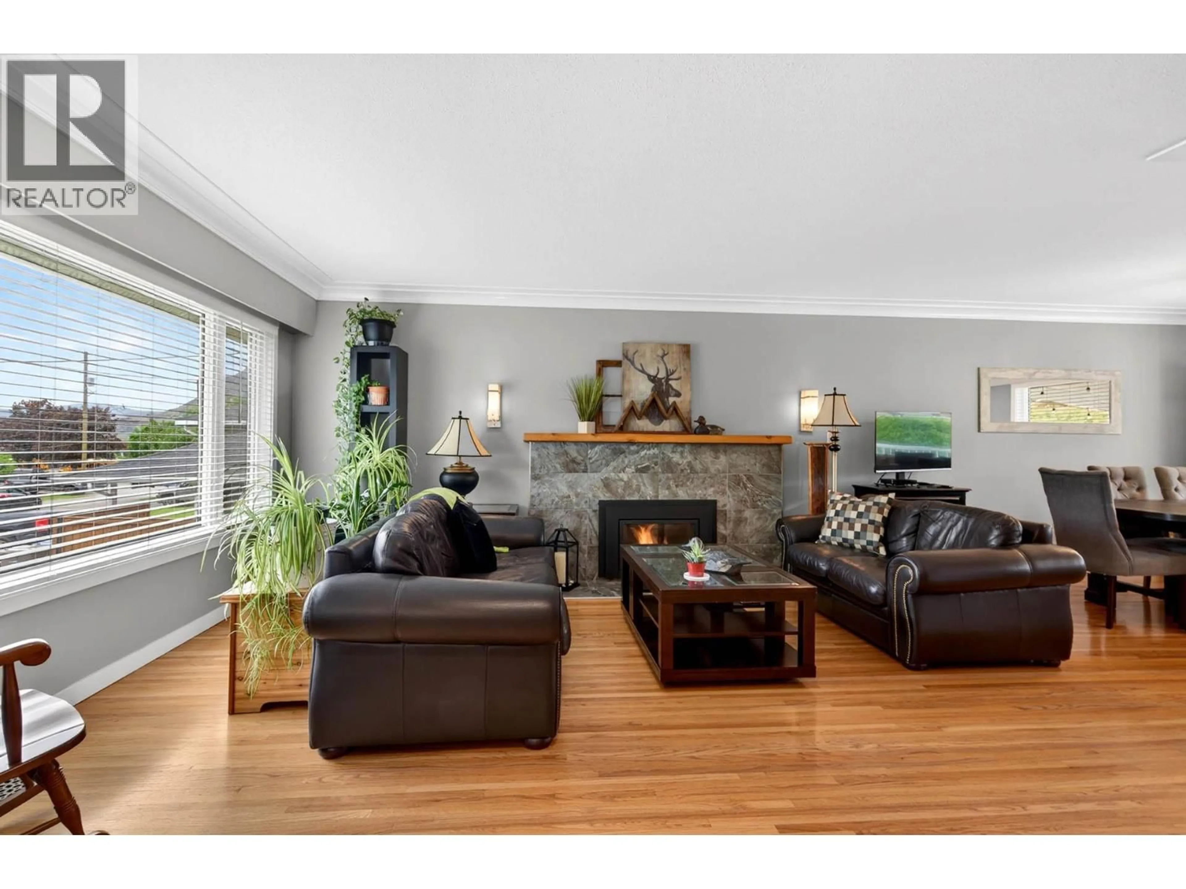 Living room with furniture, wood/laminate floor for 1775 APPLE LANE, Kamloops British Columbia V2C4M9