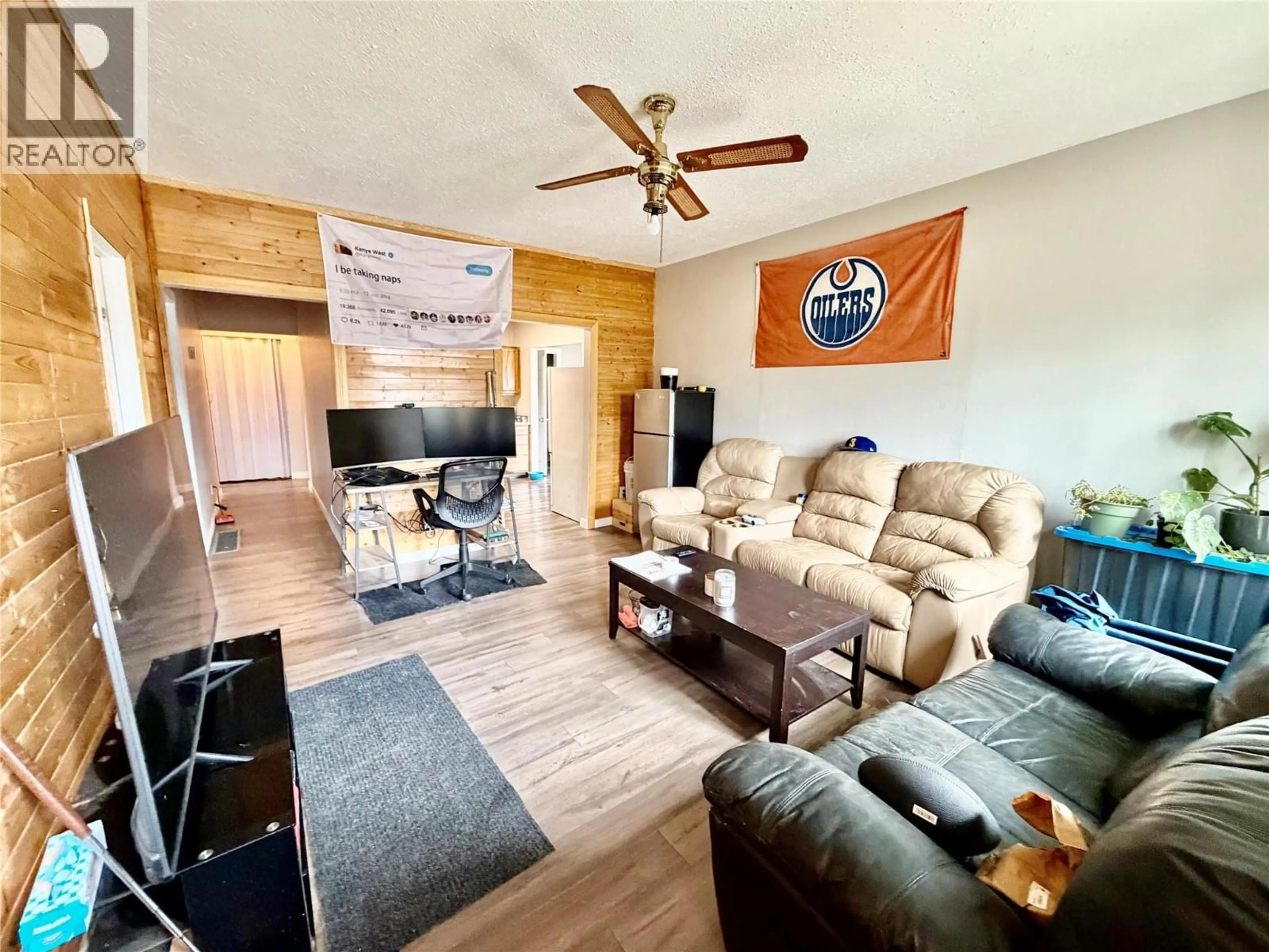 Living room with furniture, wood/laminate floor for 512 97A AVENUE, Dawson Creek British Columbia V1G1R1