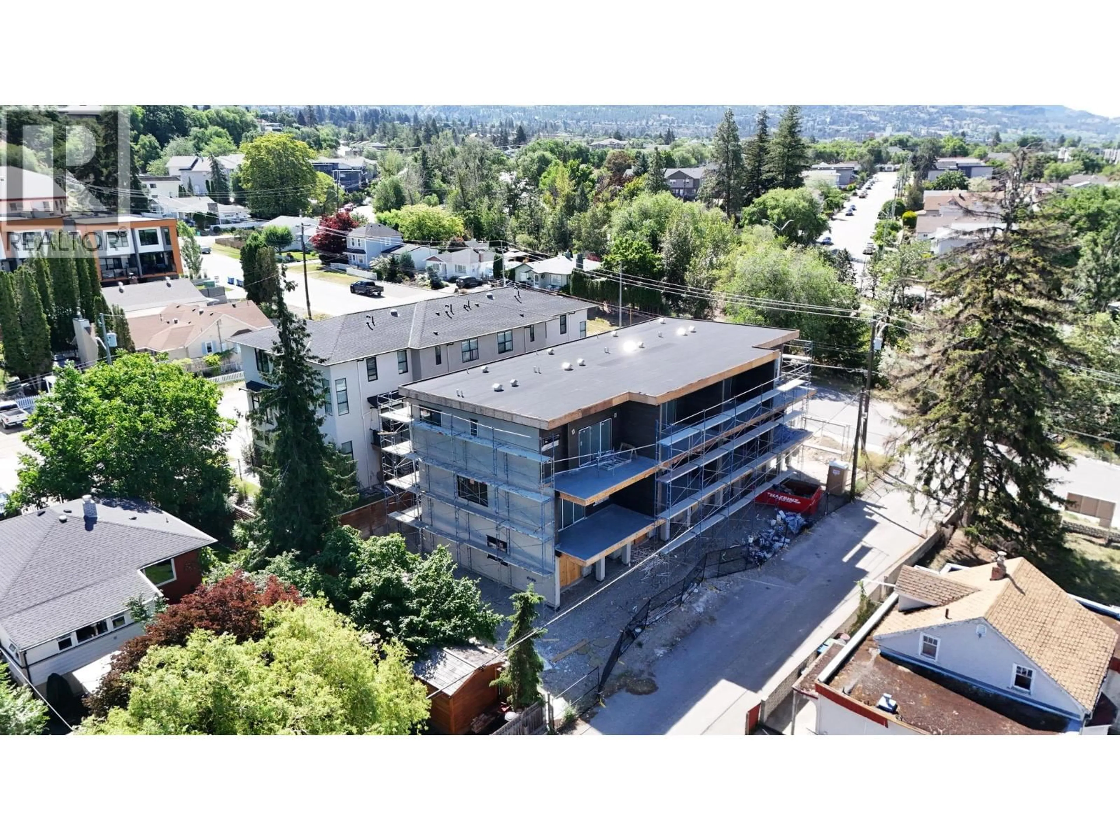 A pic from outside/outdoor area/front of a property/back of a property/a pic from drone, building for 101 - 463 WADE AVENUE, Penticton British Columbia V2A1T1