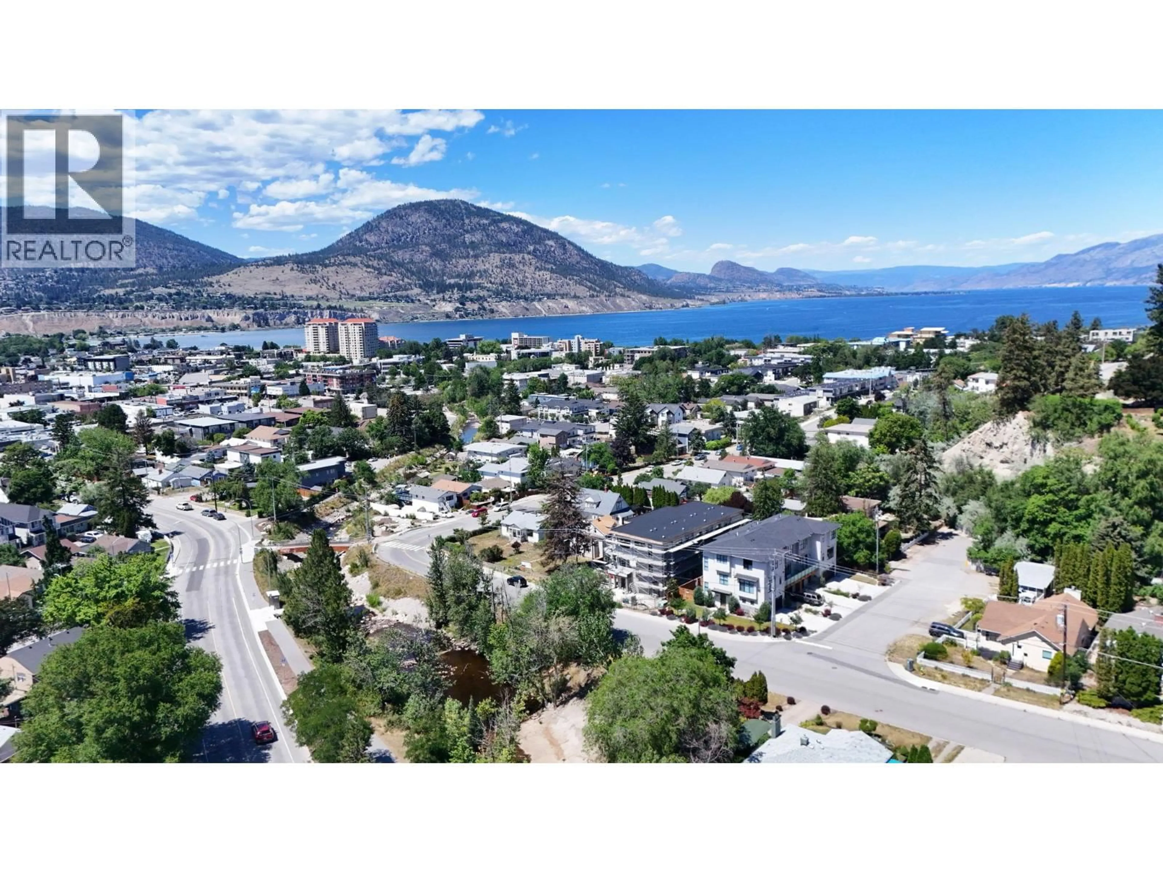 A pic from outside/outdoor area/front of a property/back of a property/a pic from drone, mountain view for 102 - 463 WADE AVENUE, Penticton British Columbia V2A1T1