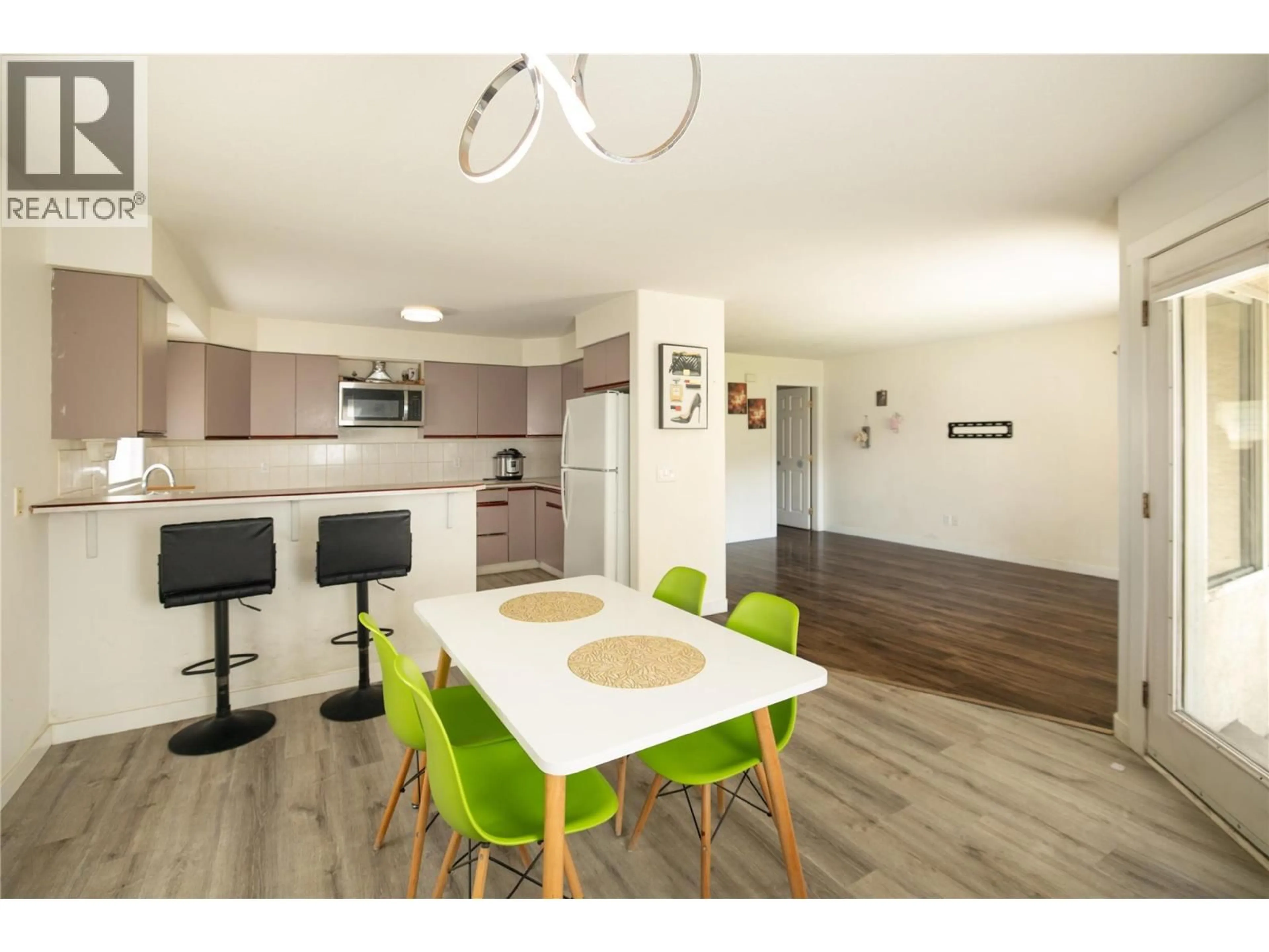 Open concept kitchen, wood/laminate floor for 1395 FRIESEN ROAD, Kelowna British Columbia V1X7P3