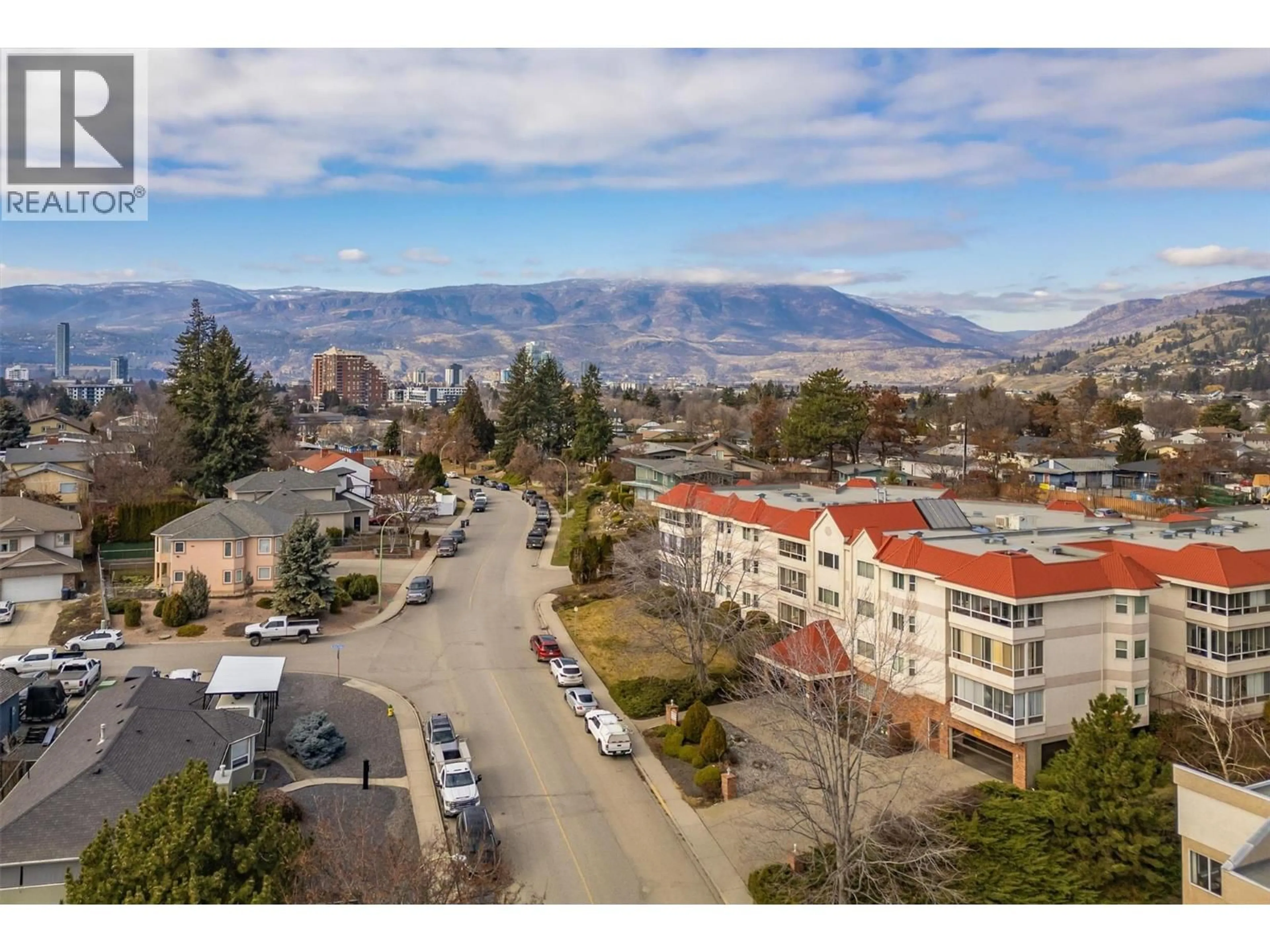 A pic from outside/outdoor area/front of a property/back of a property/a pic from drone, mountain view for 203 - 1534 LAWRENCE AVENUE, Kelowna British Columbia V1Y6M8