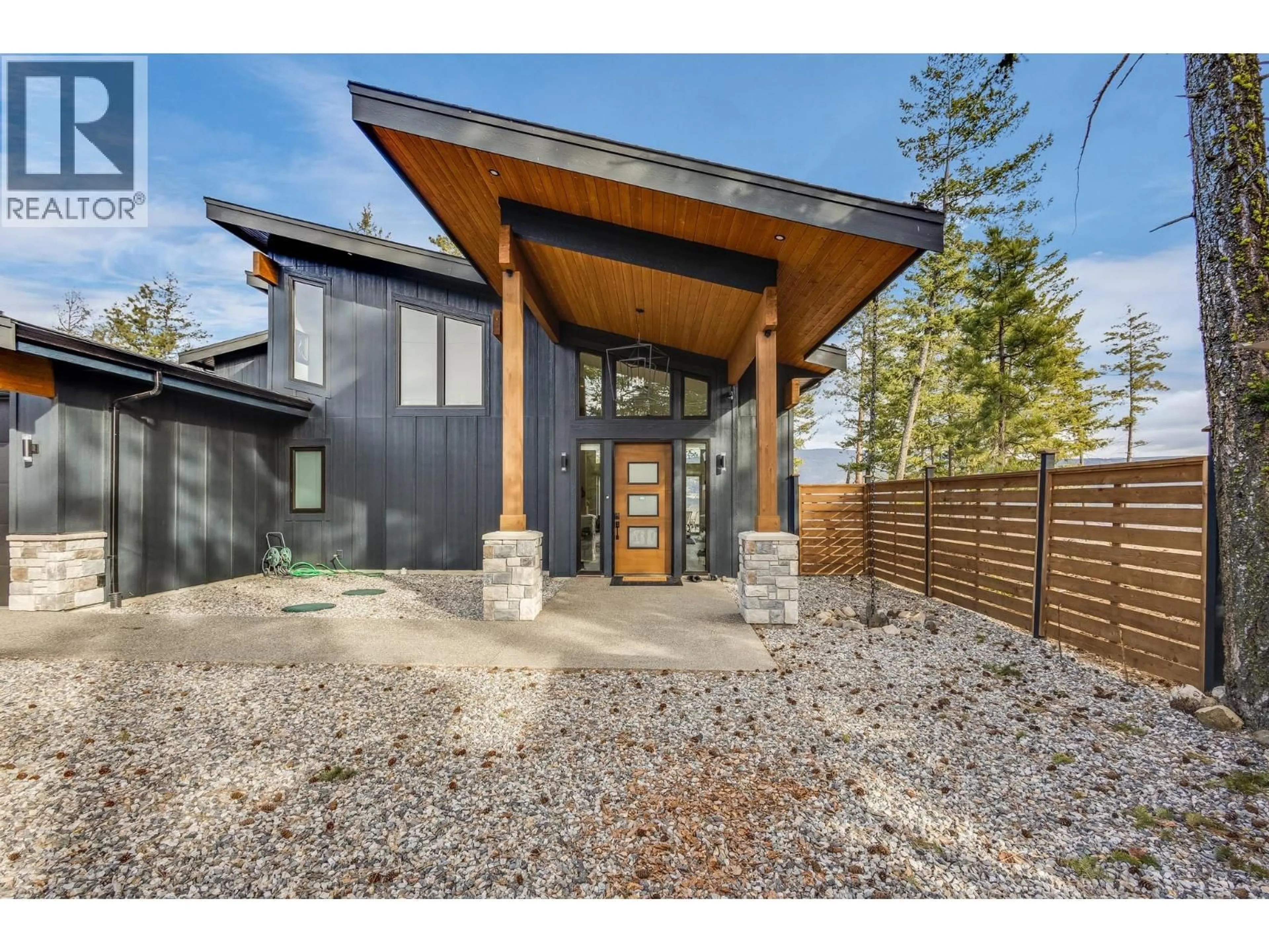 Home with brick exterior material, street for 7235 DUNWATERS ROAD, Kelowna British Columbia V1Z3W4
