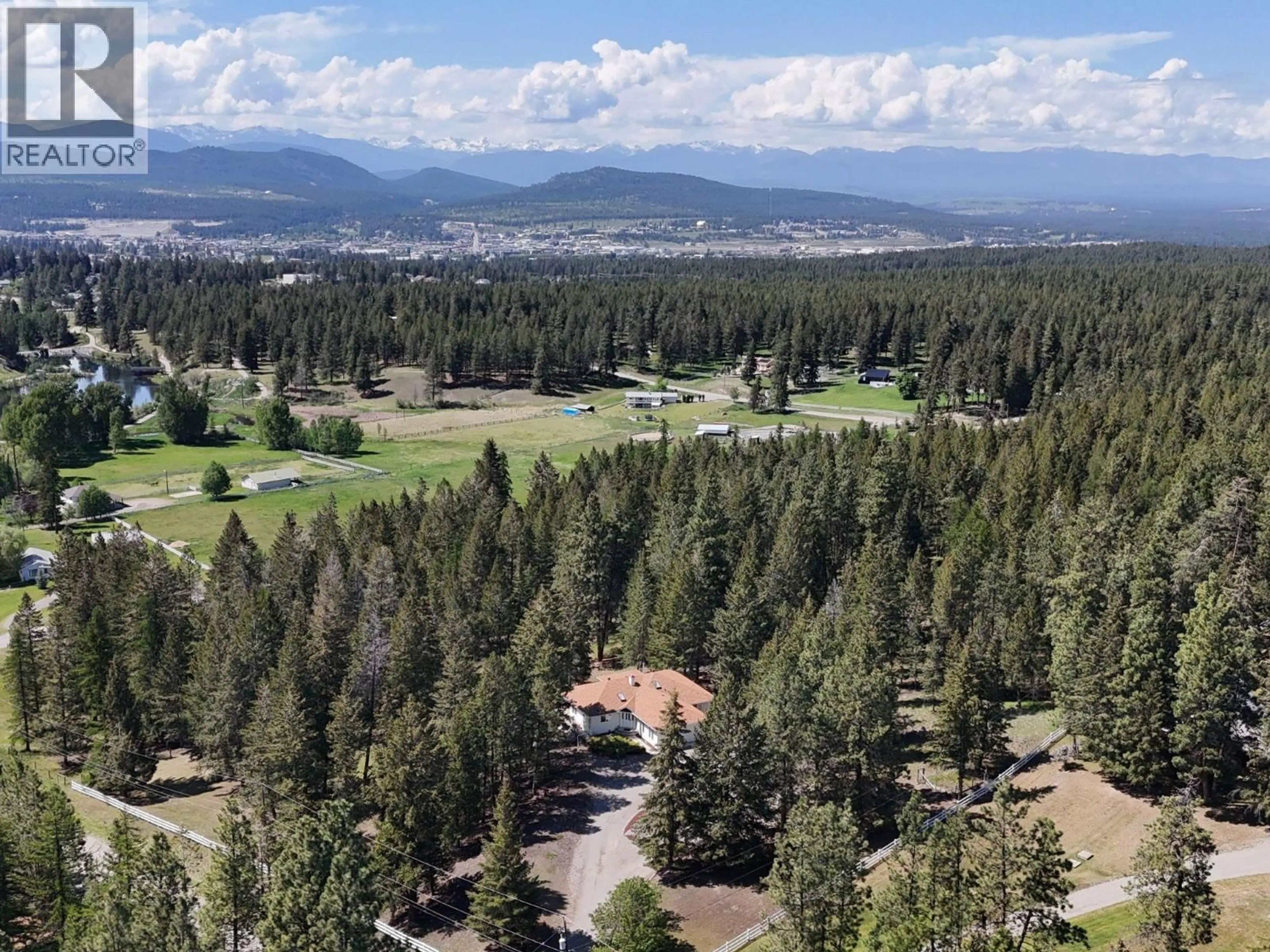 A pic from outside/outdoor area/front of a property/back of a property/a pic from drone, mountain view for 4350 13TH STREET SOUTH, Cranbrook British Columbia V1C7A9