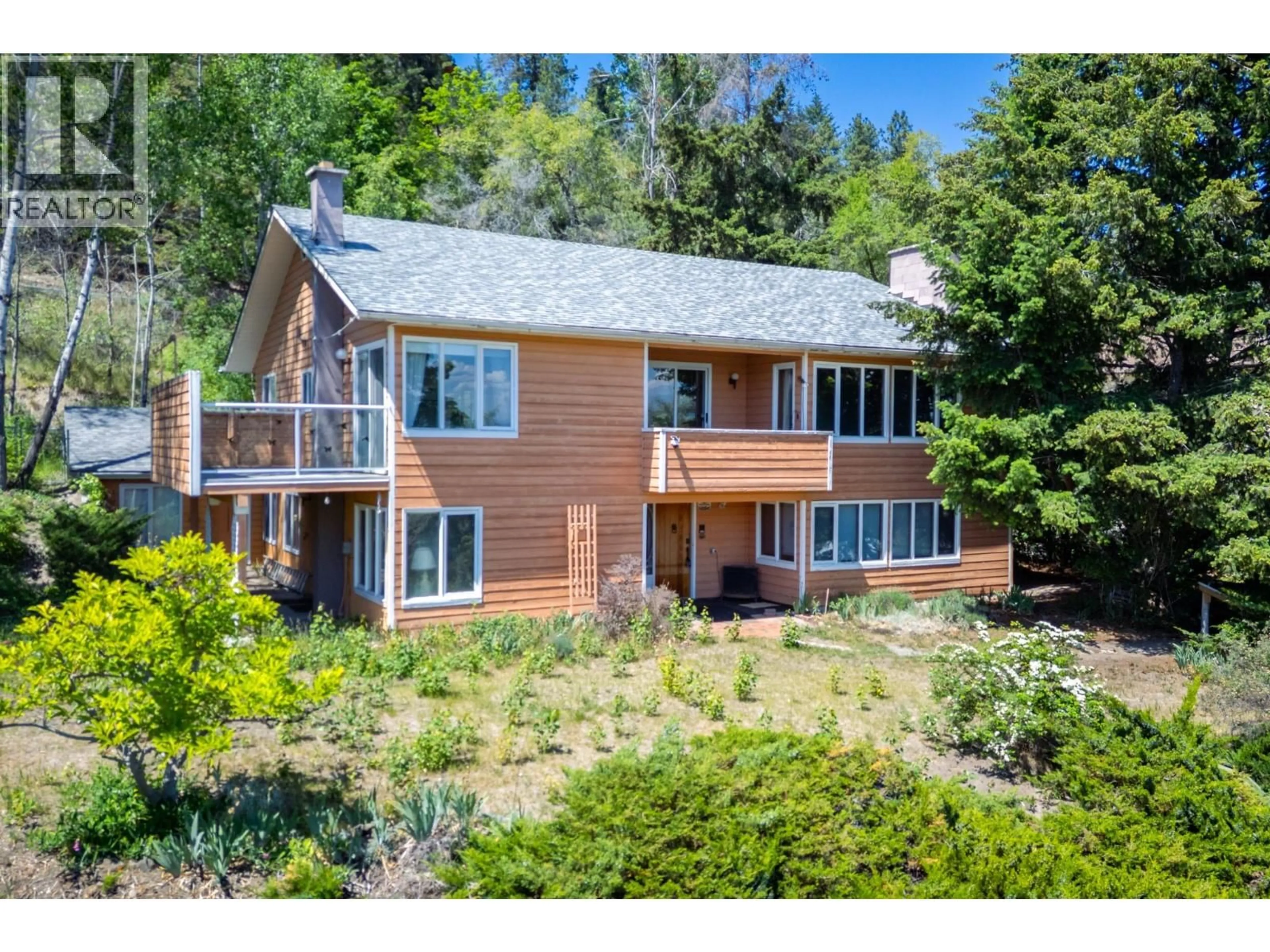 A pic from outside/outdoor area/front of a property/back of a property/a pic from drone, water/lake/river/ocean view for 1183 TREVOR DRIVE, West Kelowna British Columbia V1Z3K7