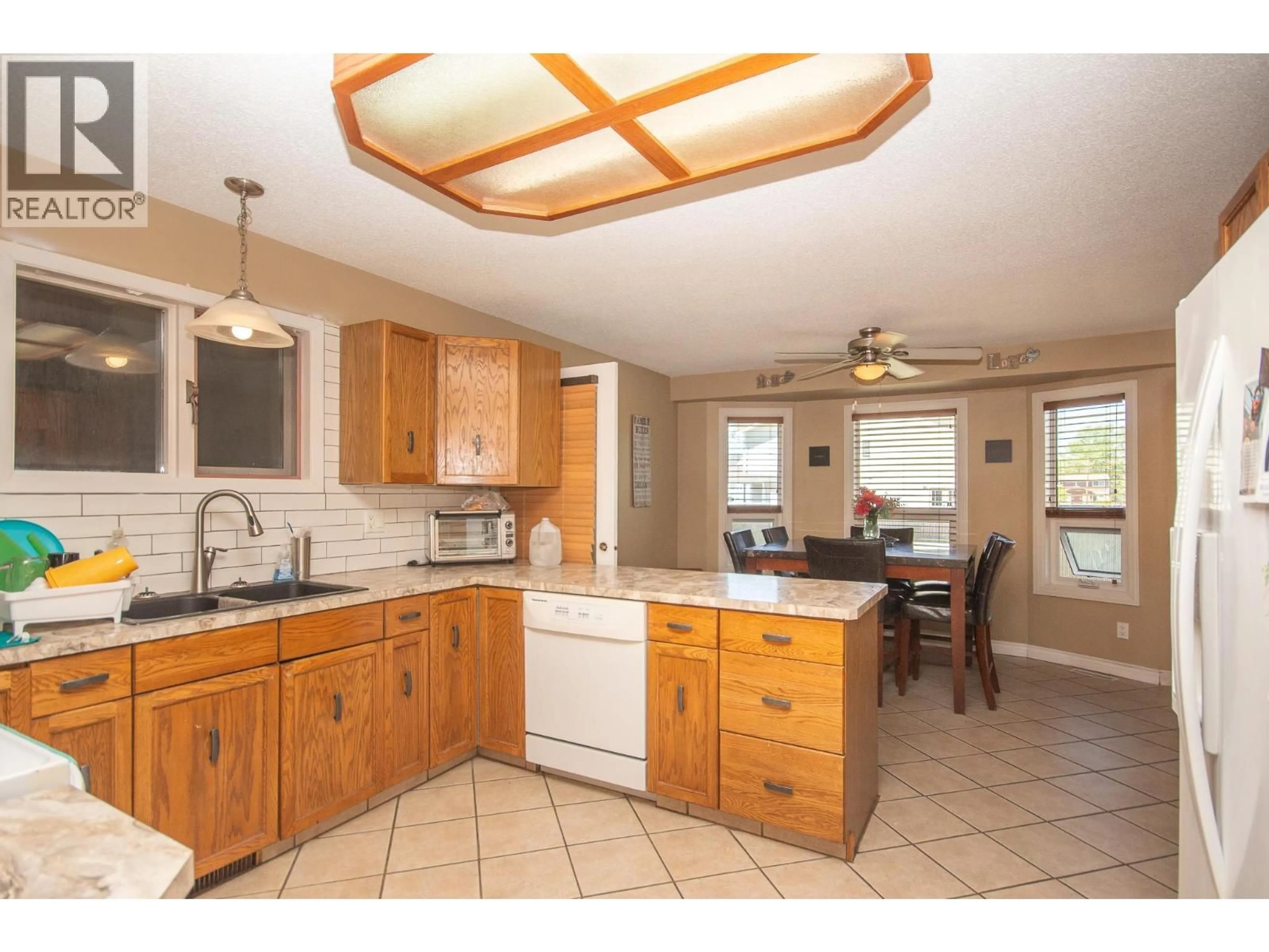 Open concept kitchen, ceramic/tile floor for 1704 CEDARWOOD COURT, Dawson Creek British Columbia V1G4L8