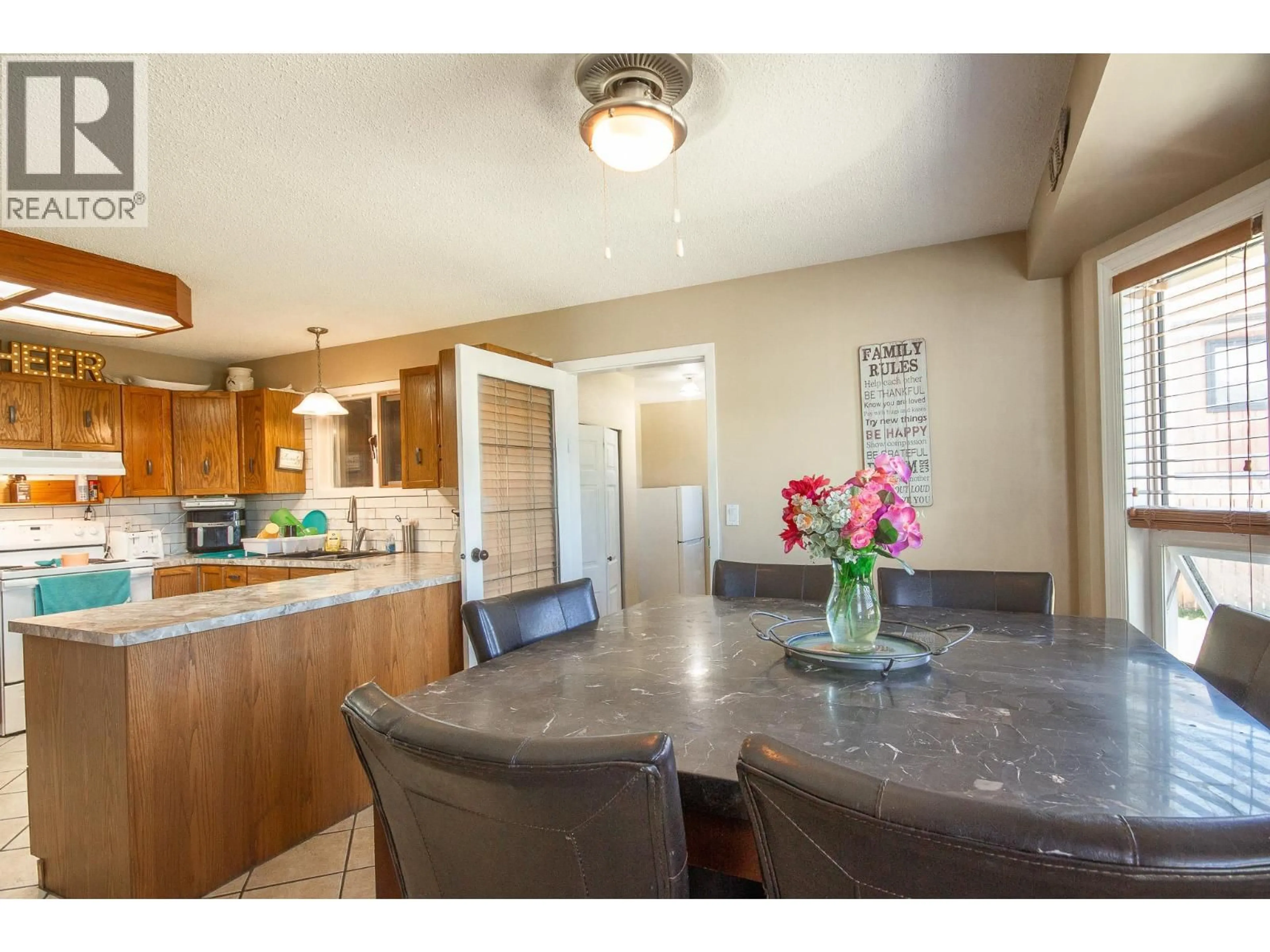 Open concept kitchen, ceramic/tile floor for 1704 CEDARWOOD COURT, Dawson Creek British Columbia V1G4L8