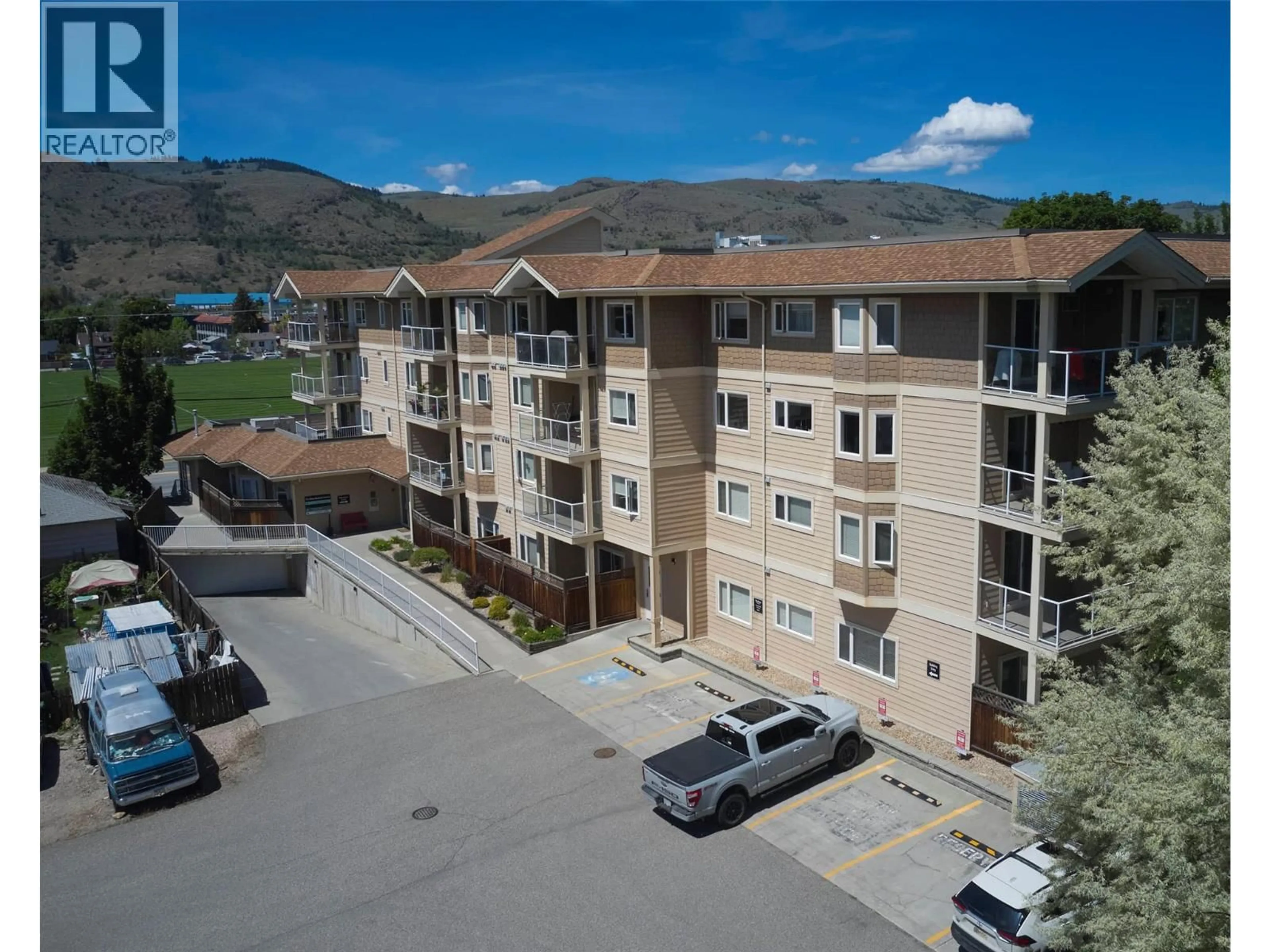A pic from outside/outdoor area/front of a property/back of a property/a pic from drone, mountain view for 206 - 4205 27 STREET, Vernon British Columbia V1T4Y3