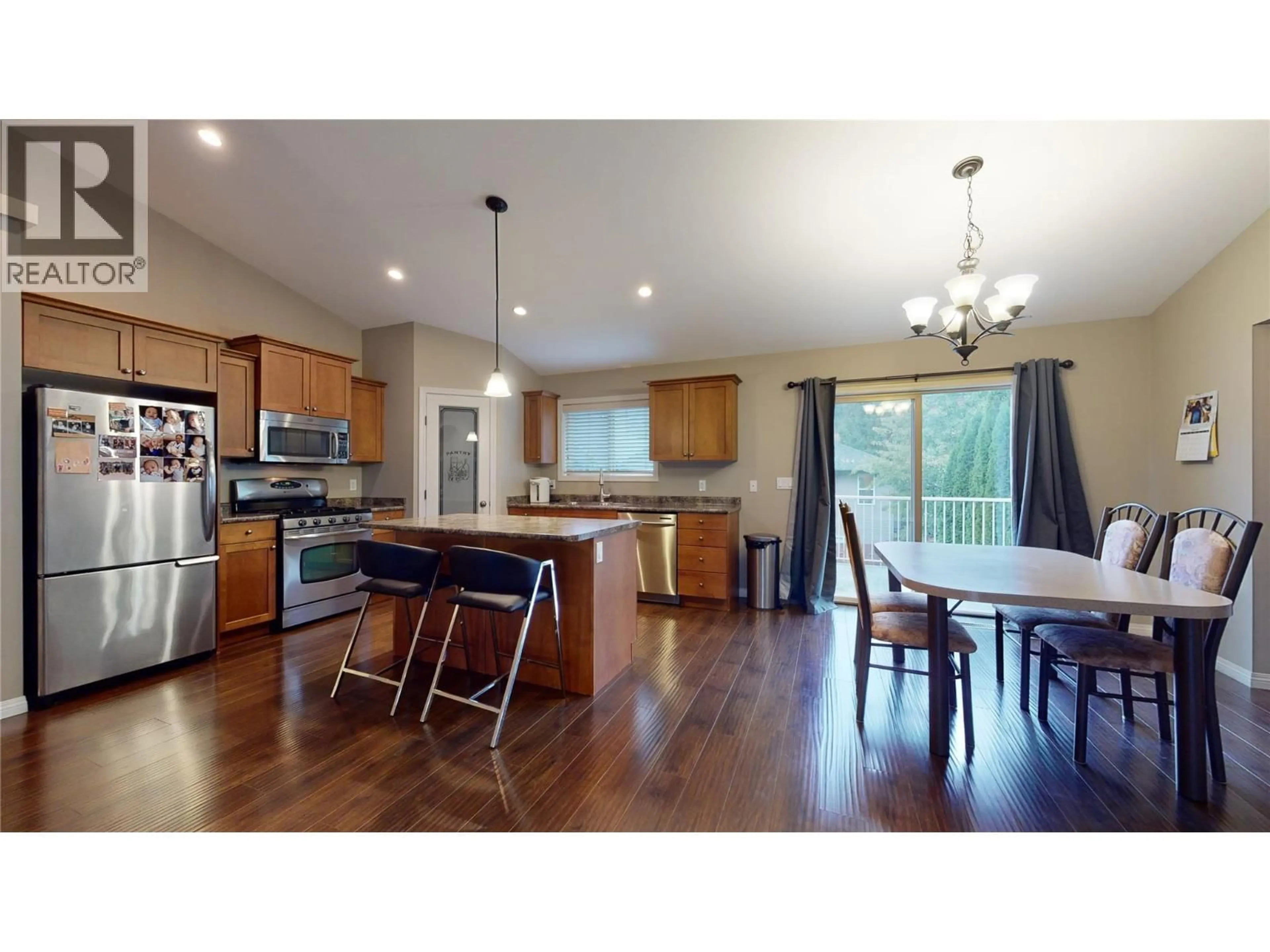 Open concept kitchen, wood/laminate floor for 2854 AUBURN ROAD, West Kelowna British Columbia V4T3B2