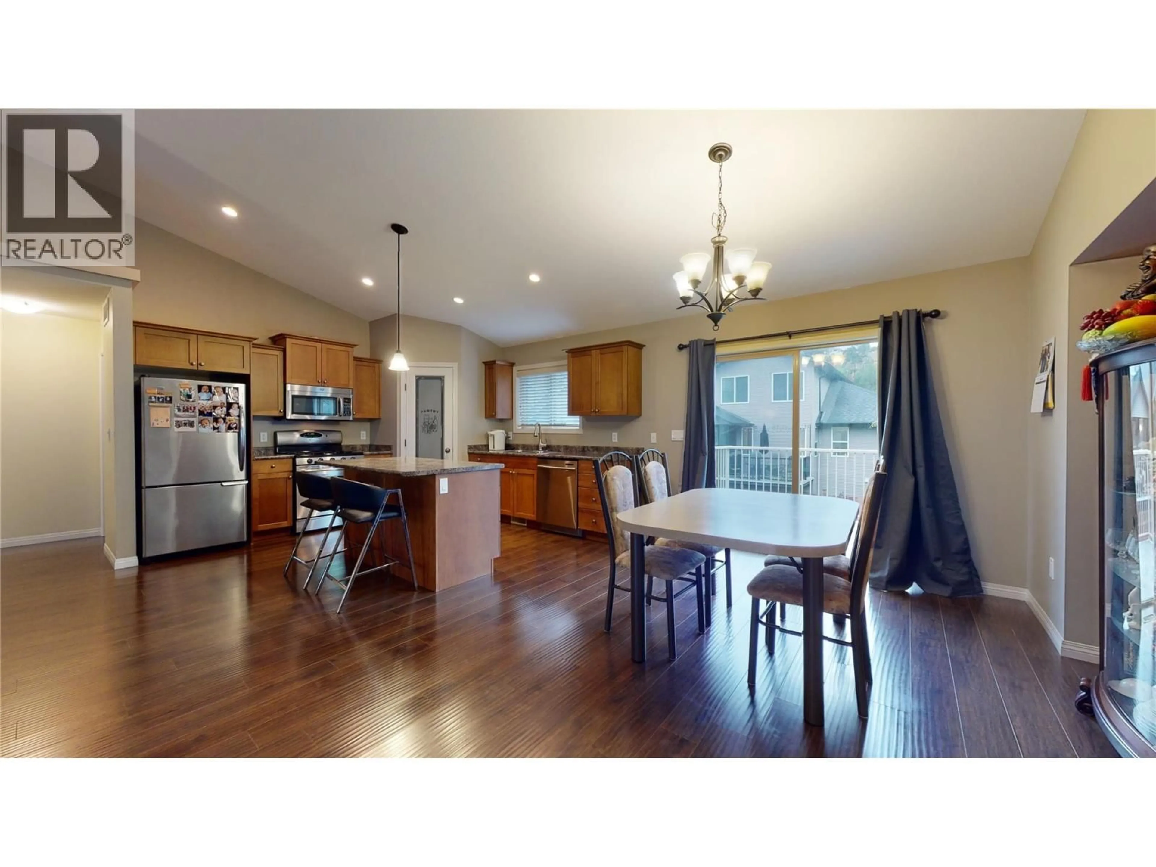 Open concept kitchen, wood/laminate floor for 2854 AUBURN ROAD, West Kelowna British Columbia V4T3B2