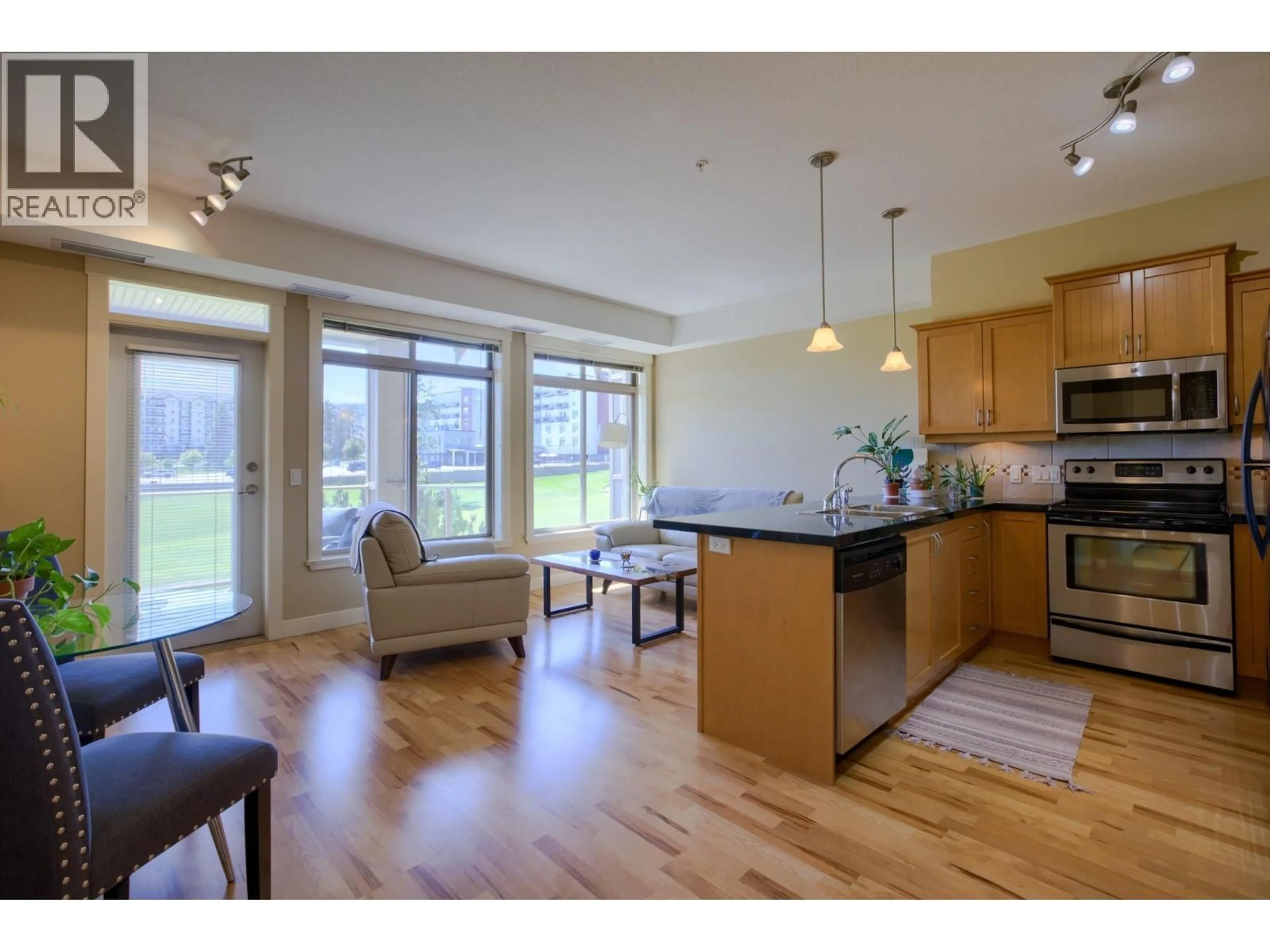 Open concept kitchen, wood/laminate floor for 206 - 3533 CARRINGTON ROAD, West Kelowna British Columbia V4T2Z9