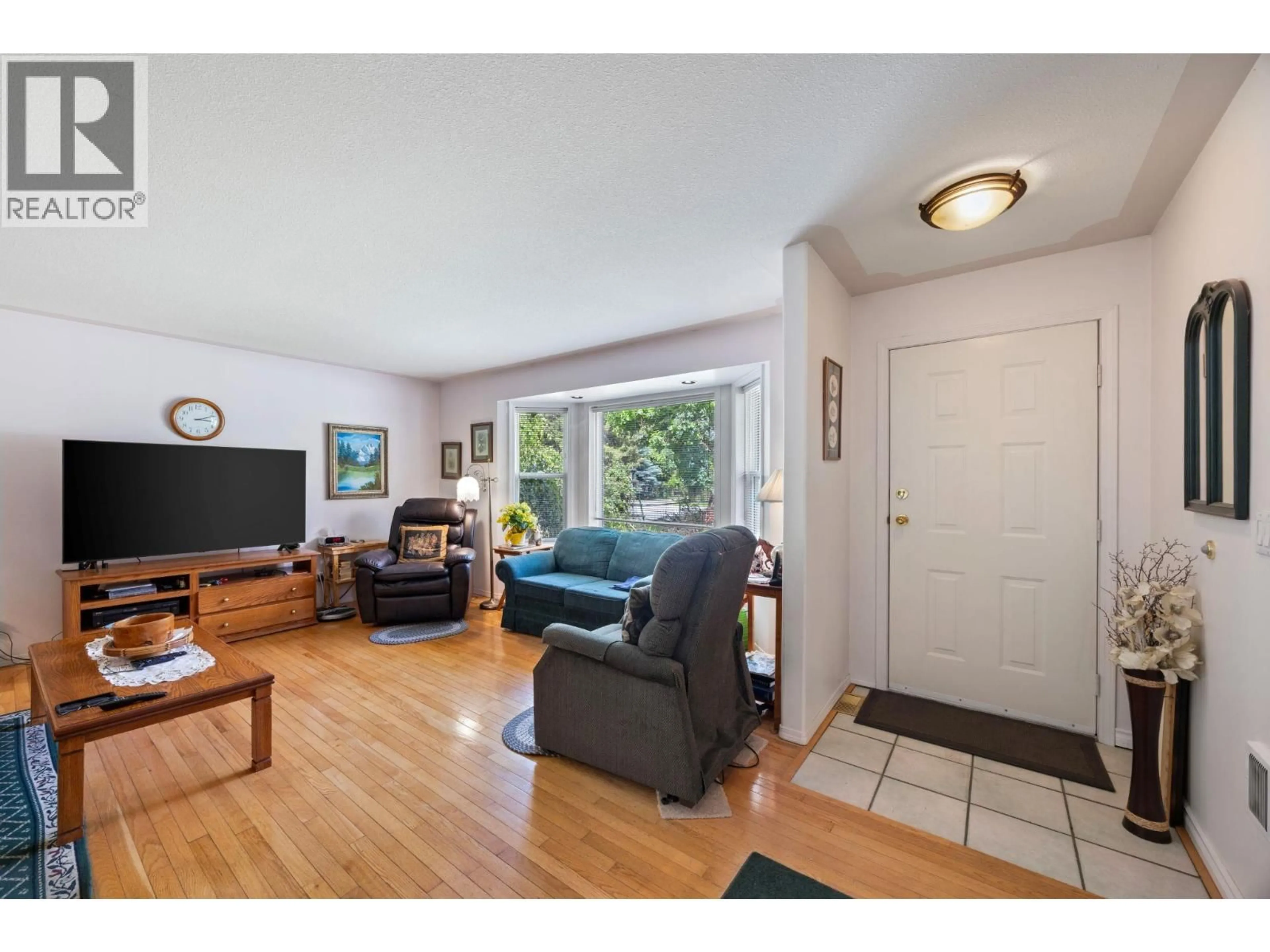 Living room with furniture, wood/laminate floor for 4341 DUNSMUIR ROAD ROAD, Barriere British Columbia V0E1E0