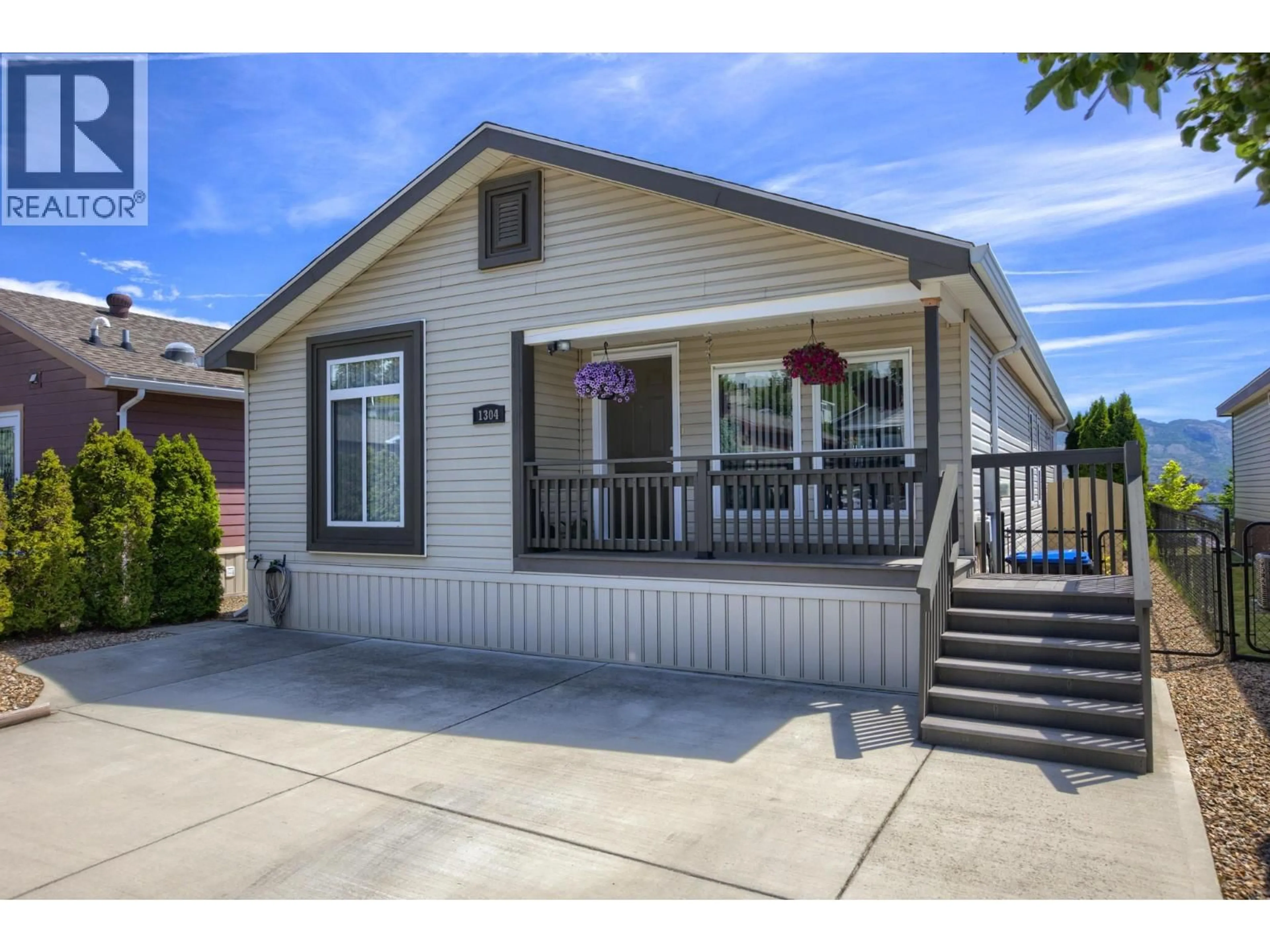 Home with vinyl exterior material, street for 1304 - 2440 OLD OKANAGAN HIGHWAY, West Kelowna British Columbia V4T3A2