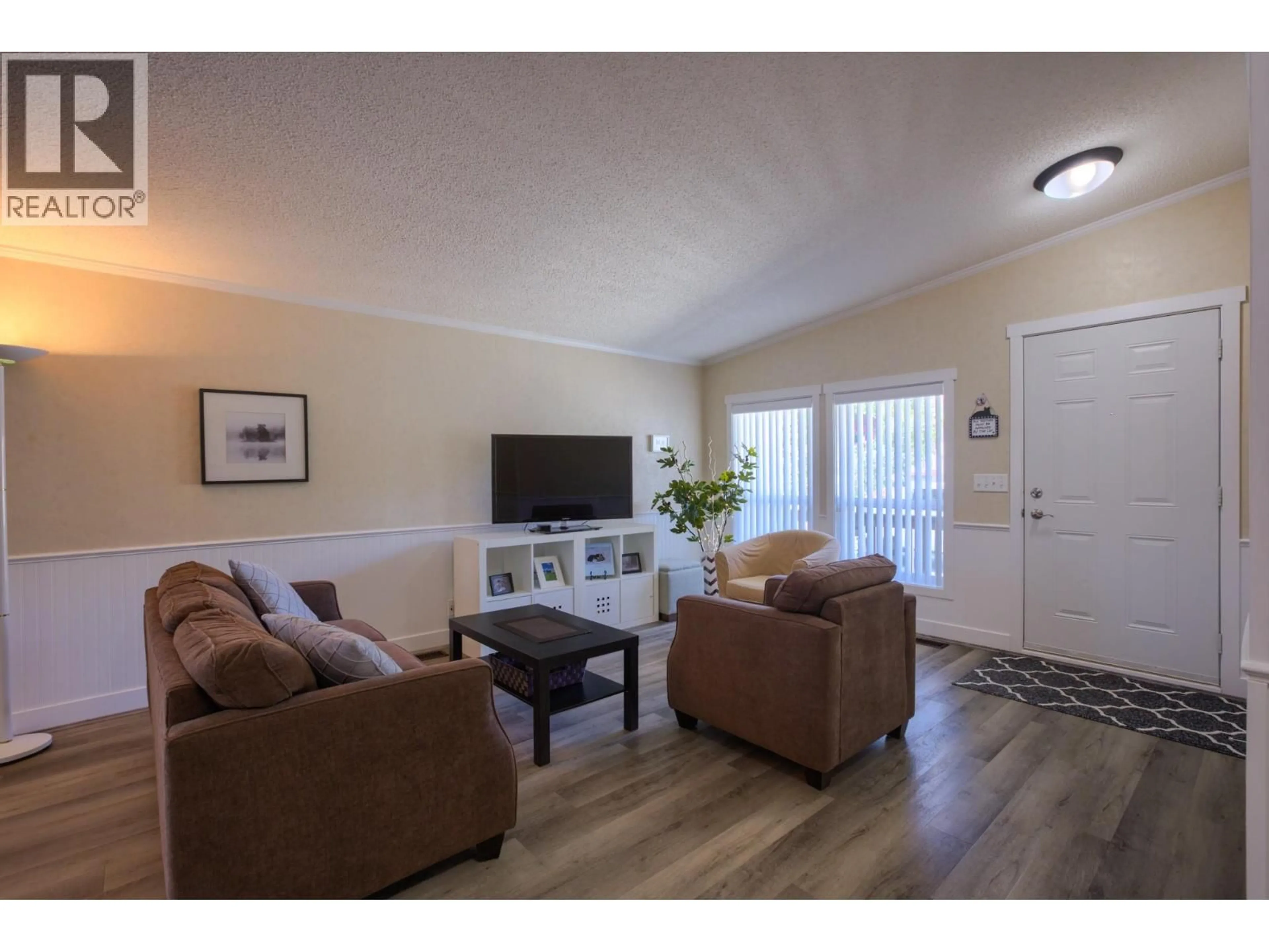 Living room with furniture, wood/laminate floor for 1304 - 2440 OLD OKANAGAN HIGHWAY, West Kelowna British Columbia V4T3A2
