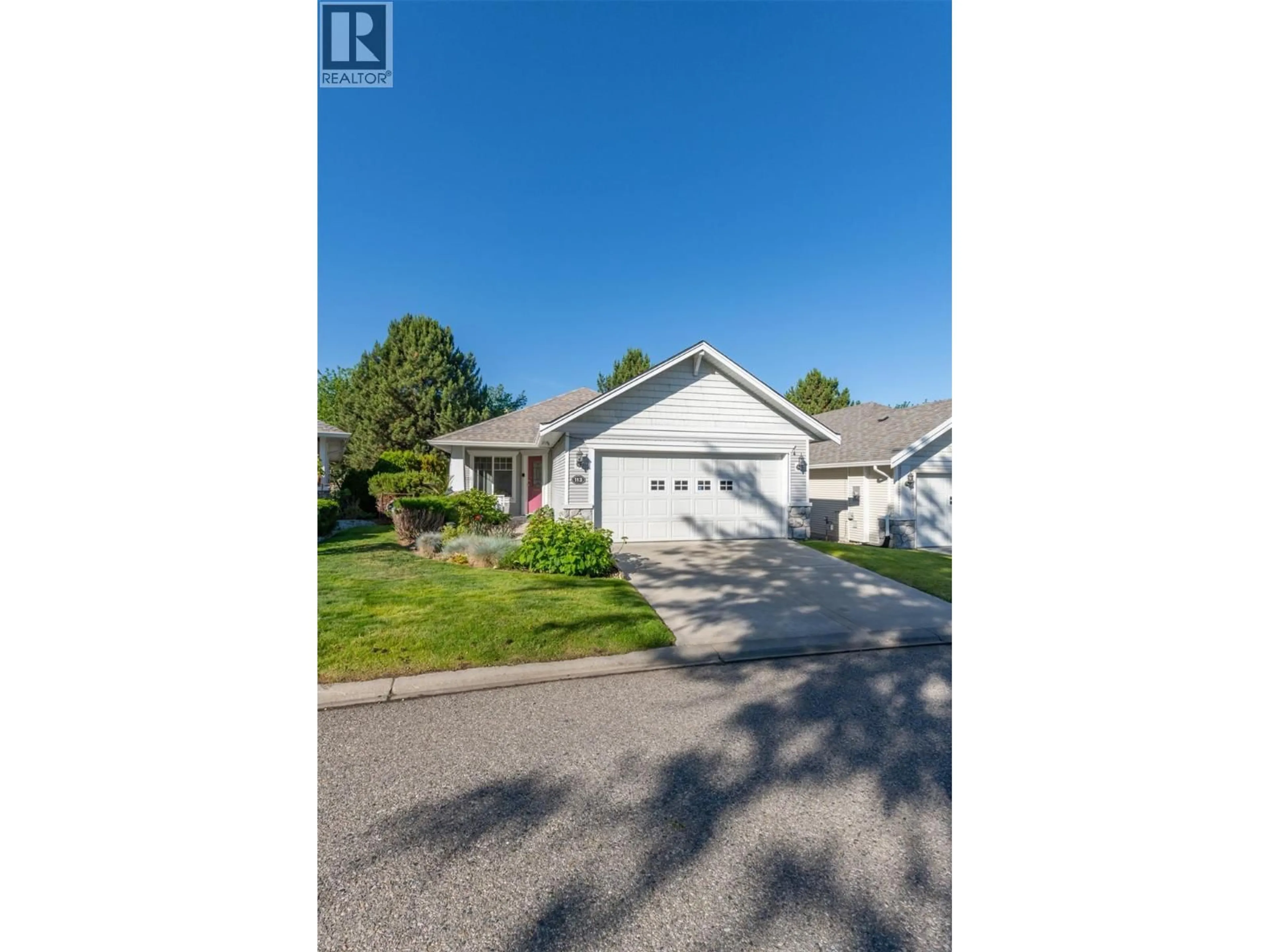 A pic from outside/outdoor area/front of a property/back of a property/a pic from drone, street for 113 - 1321 RIDGEWAY DRIVE, Kelowna British Columbia V1Y9T6