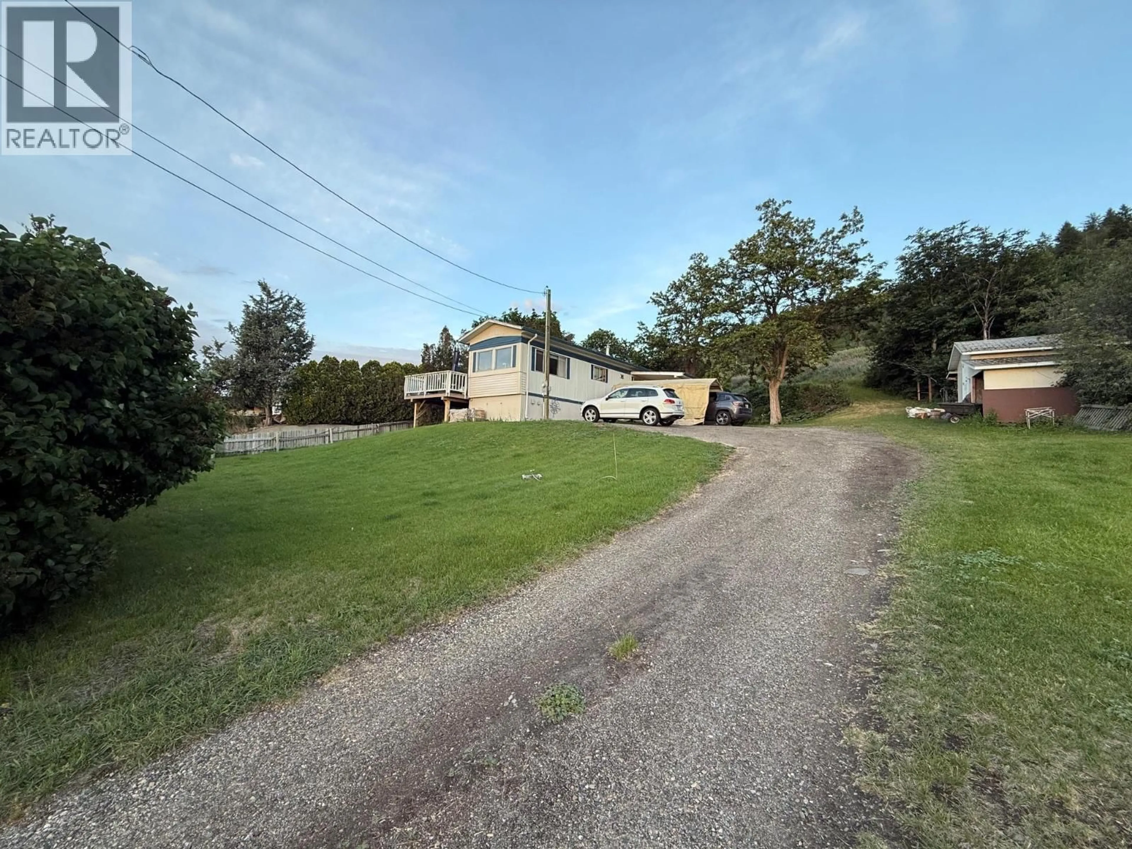 A pic from outside/outdoor area/front of a property/back of a property/a pic from drone, street for 825 MISSION ROAD, Vernon British Columbia V1H1G2