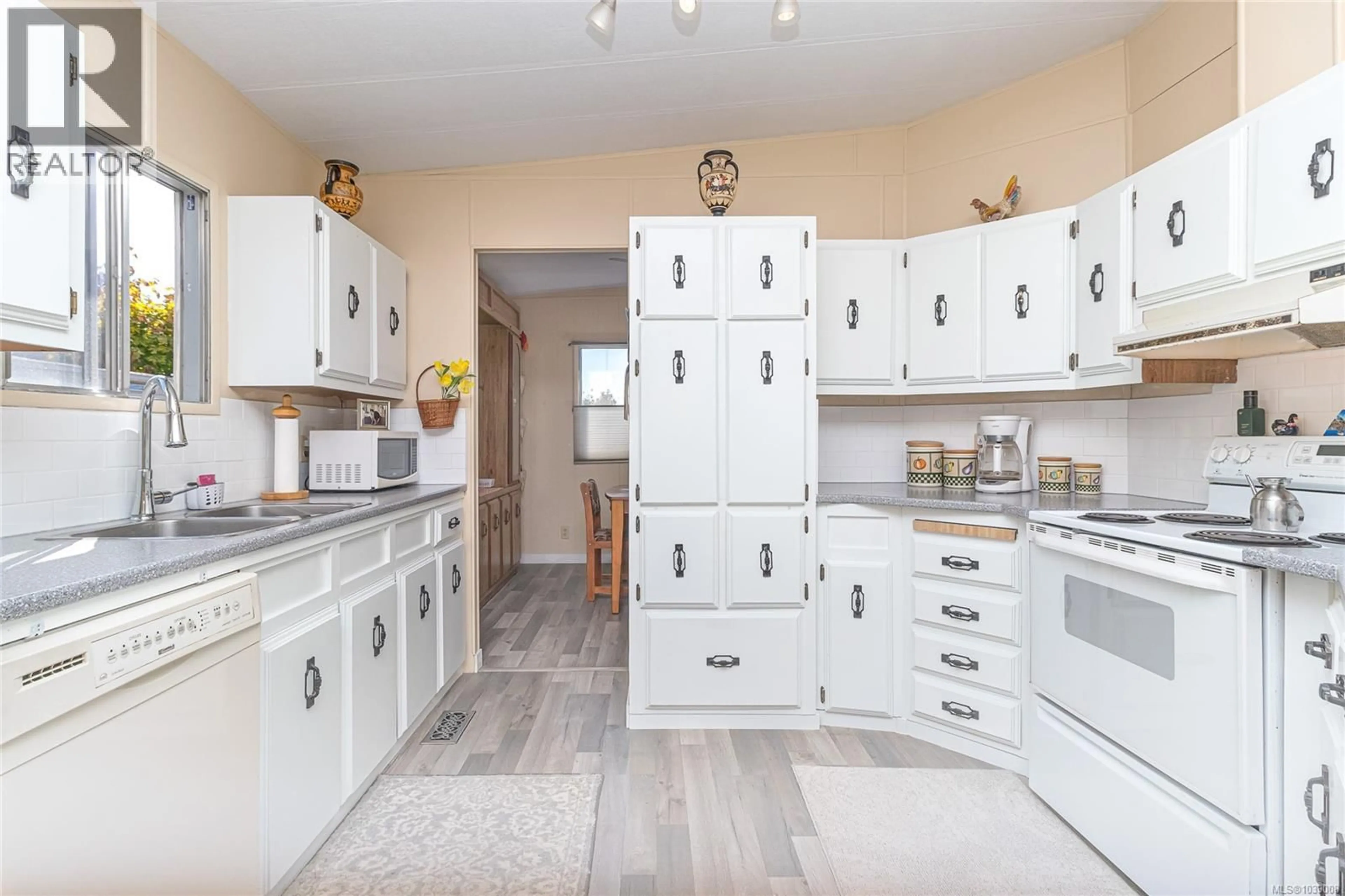 Open concept kitchen, ceramic/tile floor for 49 - 2847 SOOKE LAKE ROAD, Langford British Columbia V9B4P8