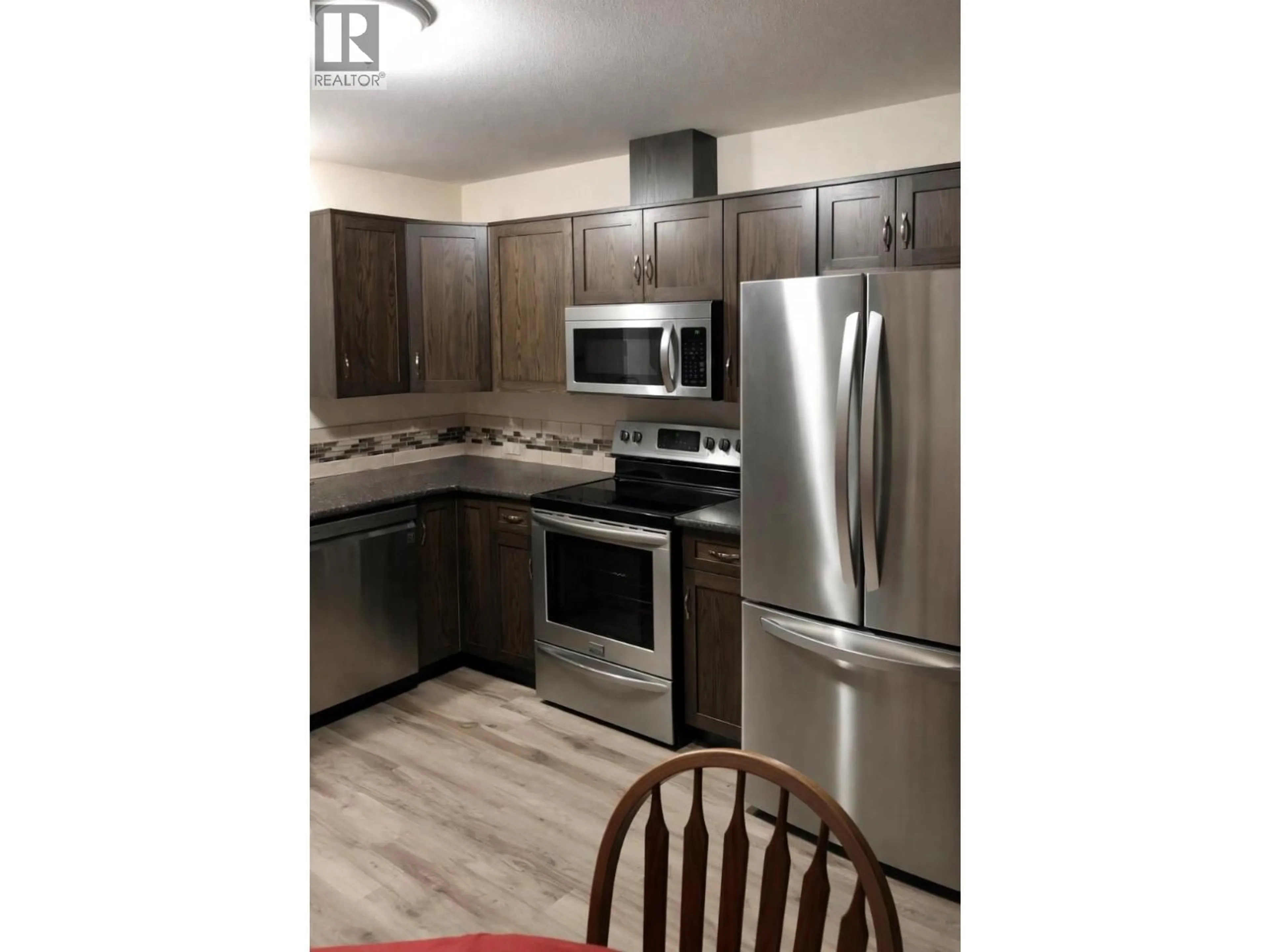 Standard kitchen, wood/laminate floor for 2052 ATKINSON STREET, Penticton British Columbia V2A8H5
