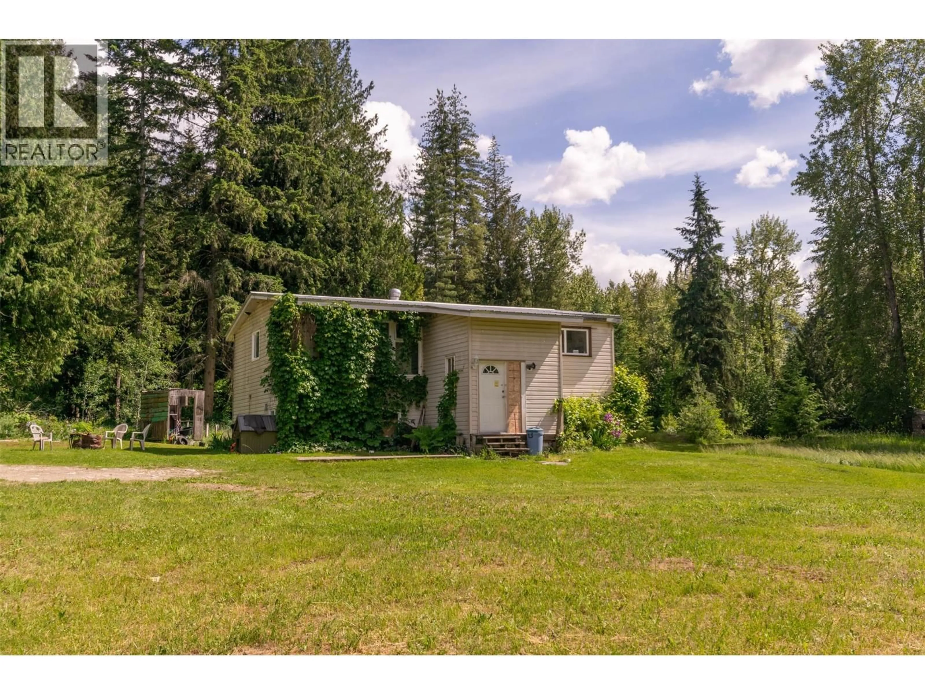 A pic from outside/outdoor area/front of a property/back of a property/a pic from drone, forest/trees view for 34 WEST POIRIER ROAD, Mara British Columbia V0E2K0
