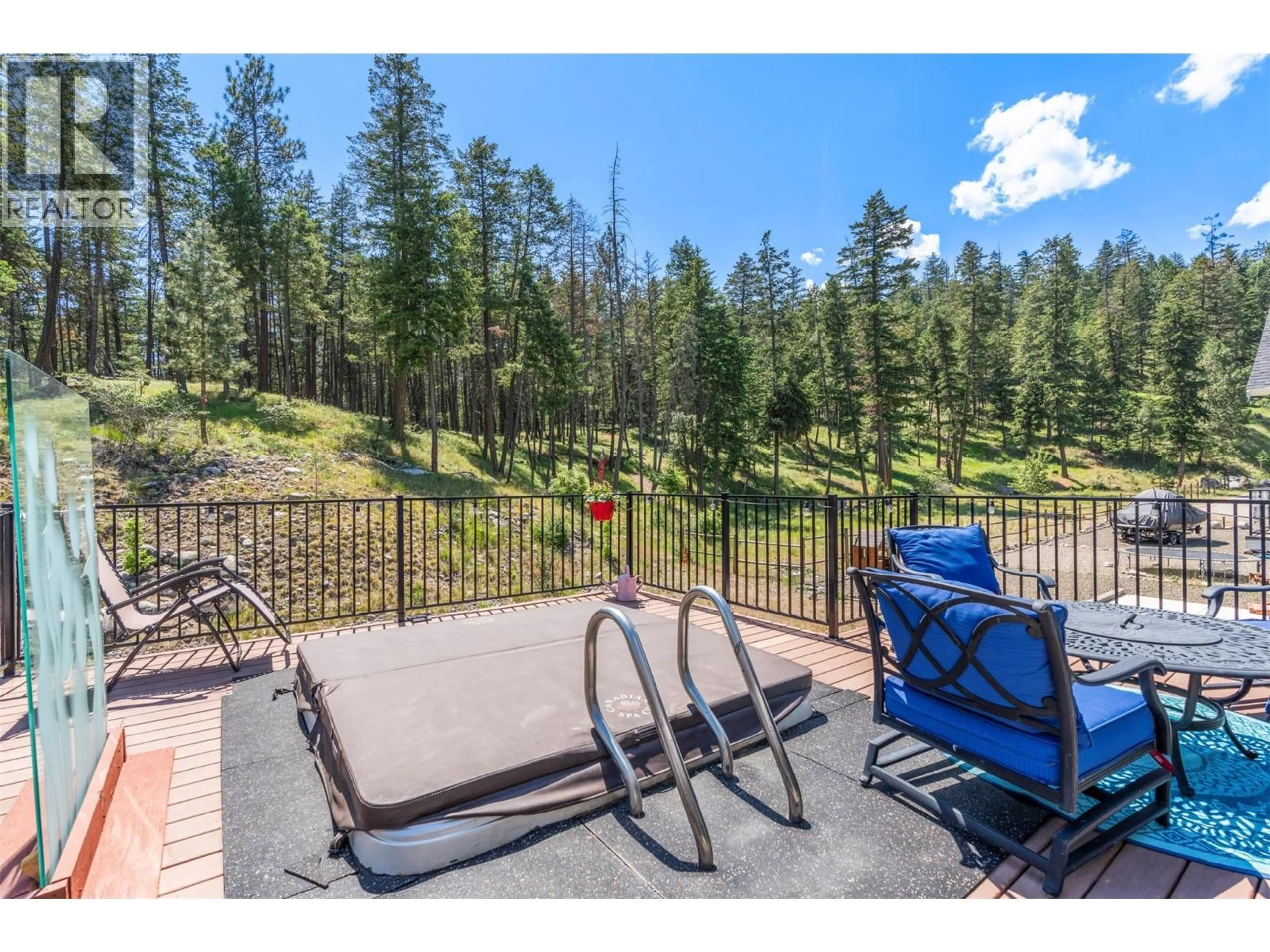 Patio, forest/trees view for 307 - 6816 MADRID WAY, Kelowna British Columbia V1Z3R8