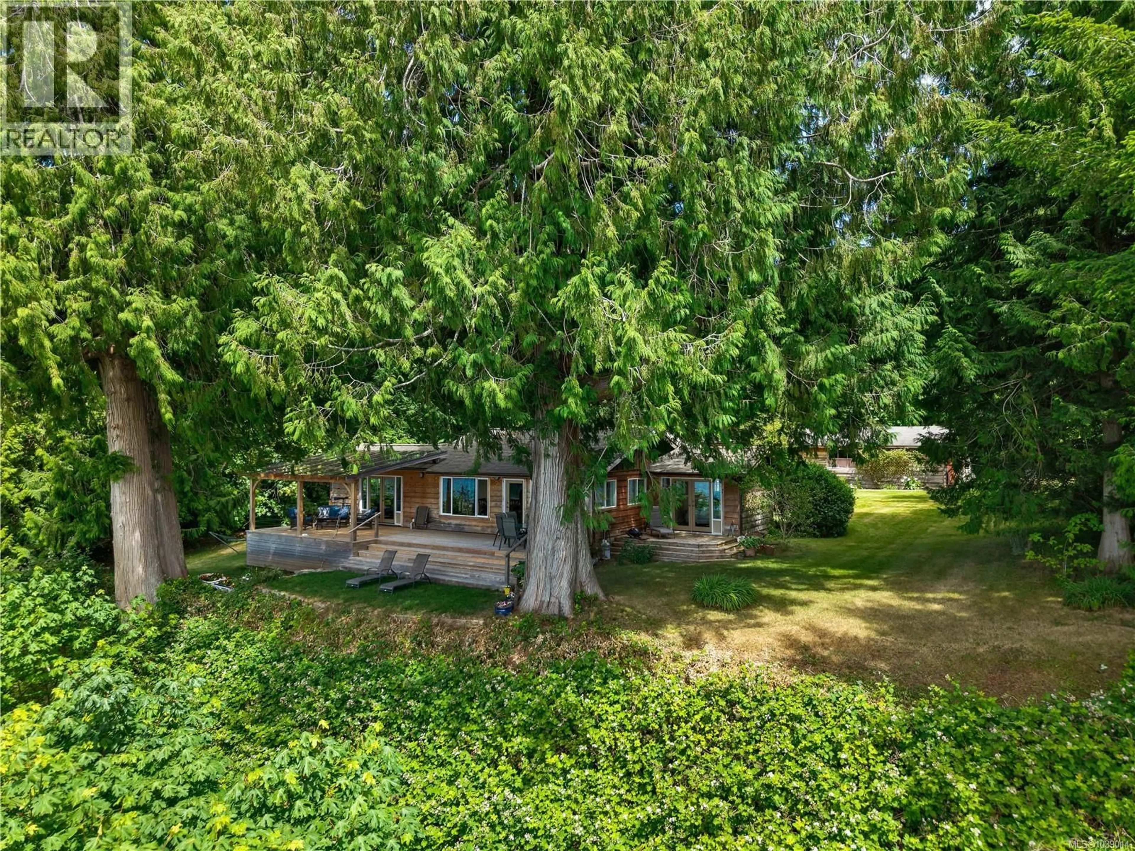 A pic from outside/outdoor area/front of a property/back of a property/a pic from drone, forest/trees view for 569 POTLATCH ROAD, Cortes Island British Columbia V0P1K0