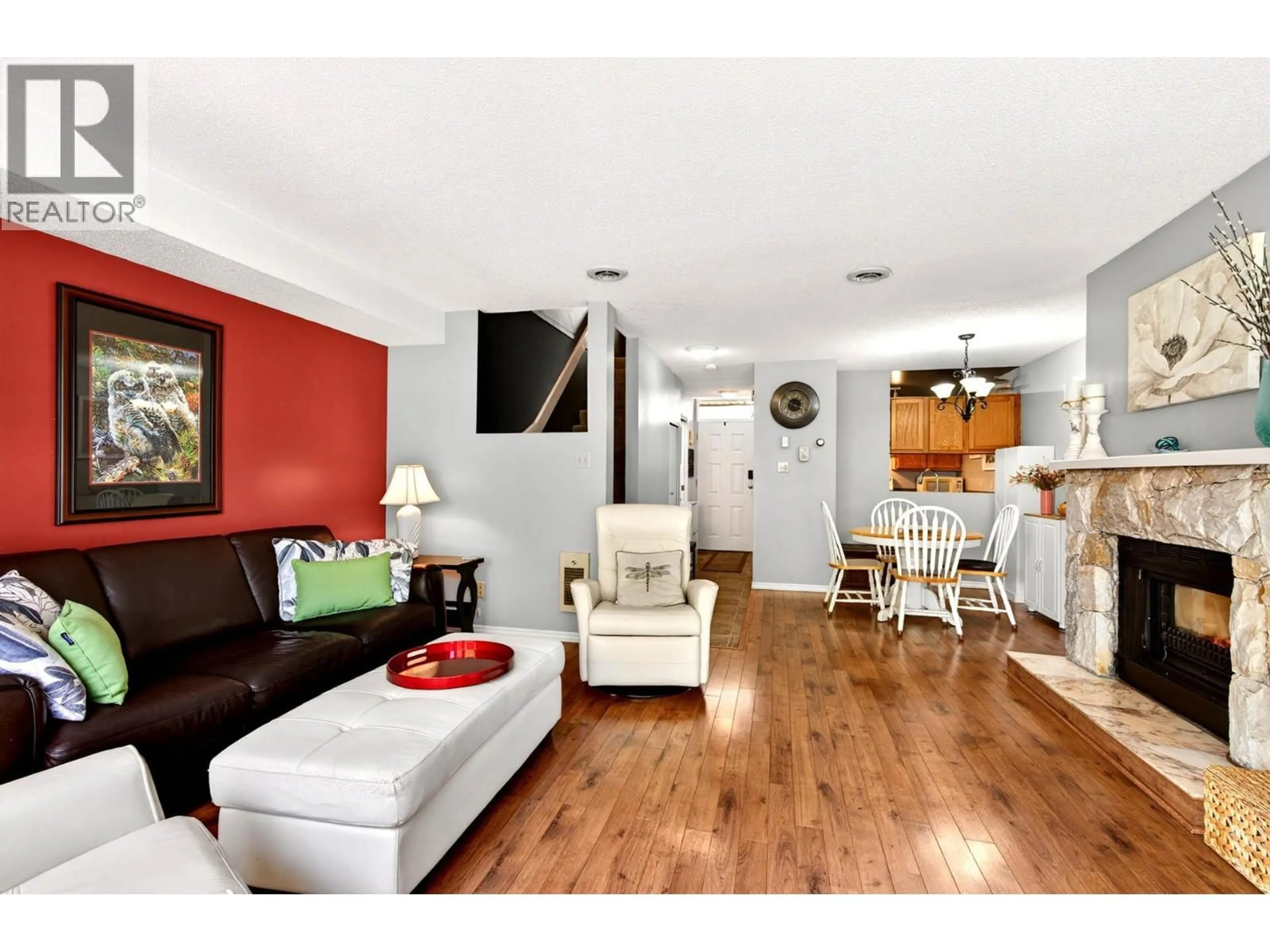 Living room with furniture, wood/laminate floor for 15 - 145 NICOLA STREET, Kamloops British Columbia V2C2P2