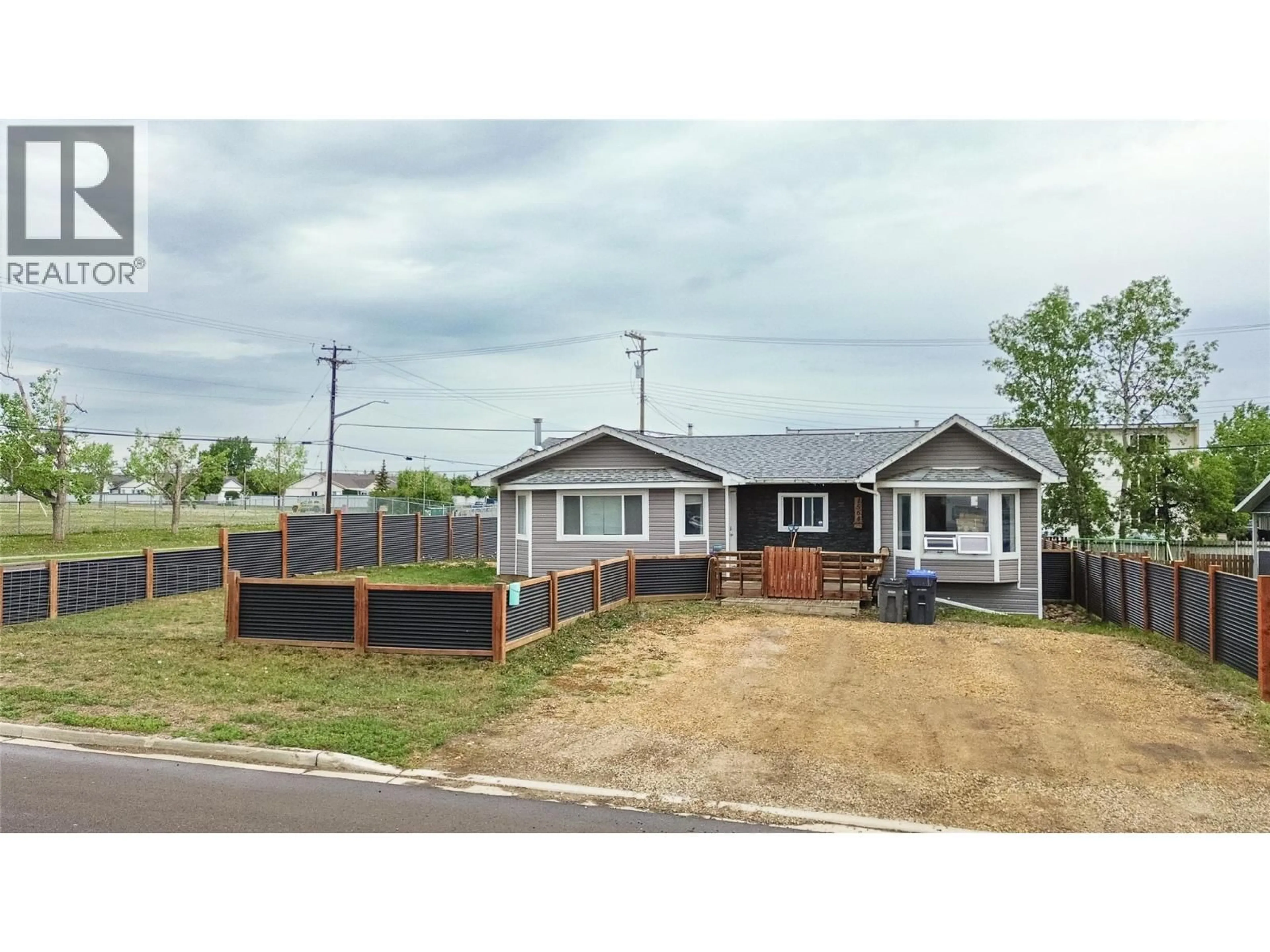 A pic from outside/outdoor area/front of a property/back of a property/a pic from drone, street for 1564 109 AVENUE, Dawson Creek British Columbia V1G2V2