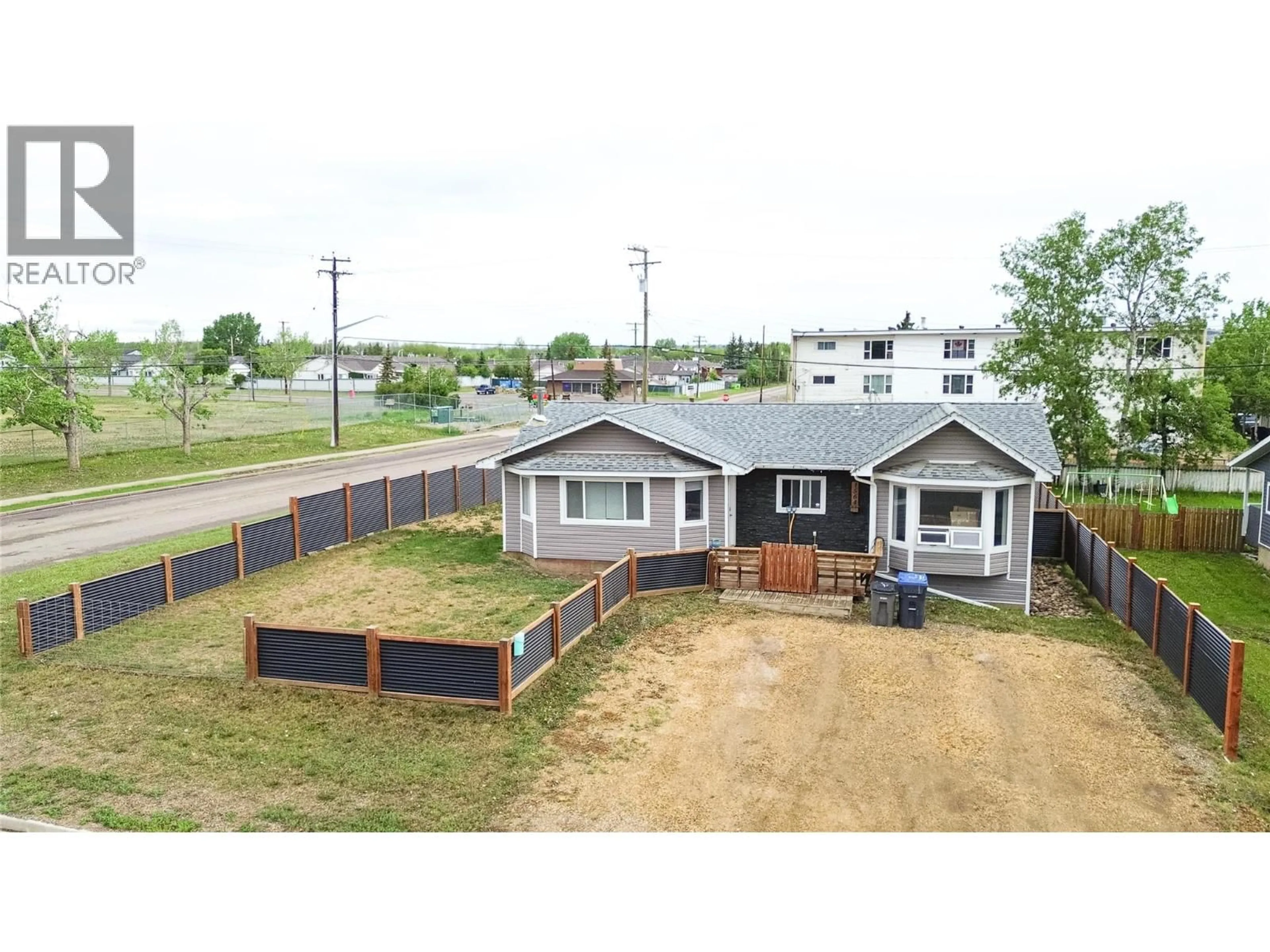 A pic from outside/outdoor area/front of a property/back of a property/a pic from drone, building for 1564 109 AVENUE, Dawson Creek British Columbia V1G2V2