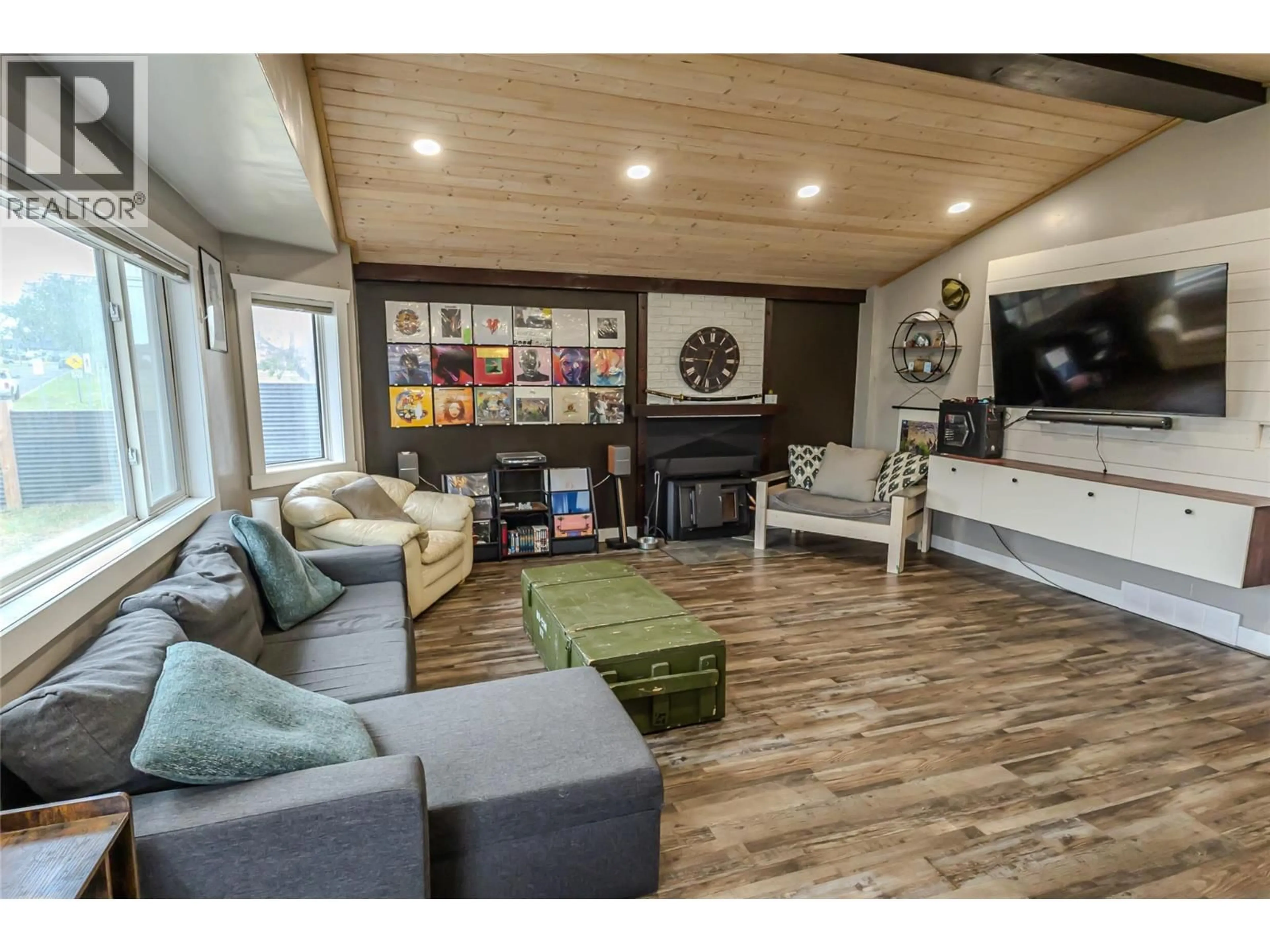 Living room with furniture, wood/laminate floor for 1564 109 AVENUE, Dawson Creek British Columbia V1G2V2