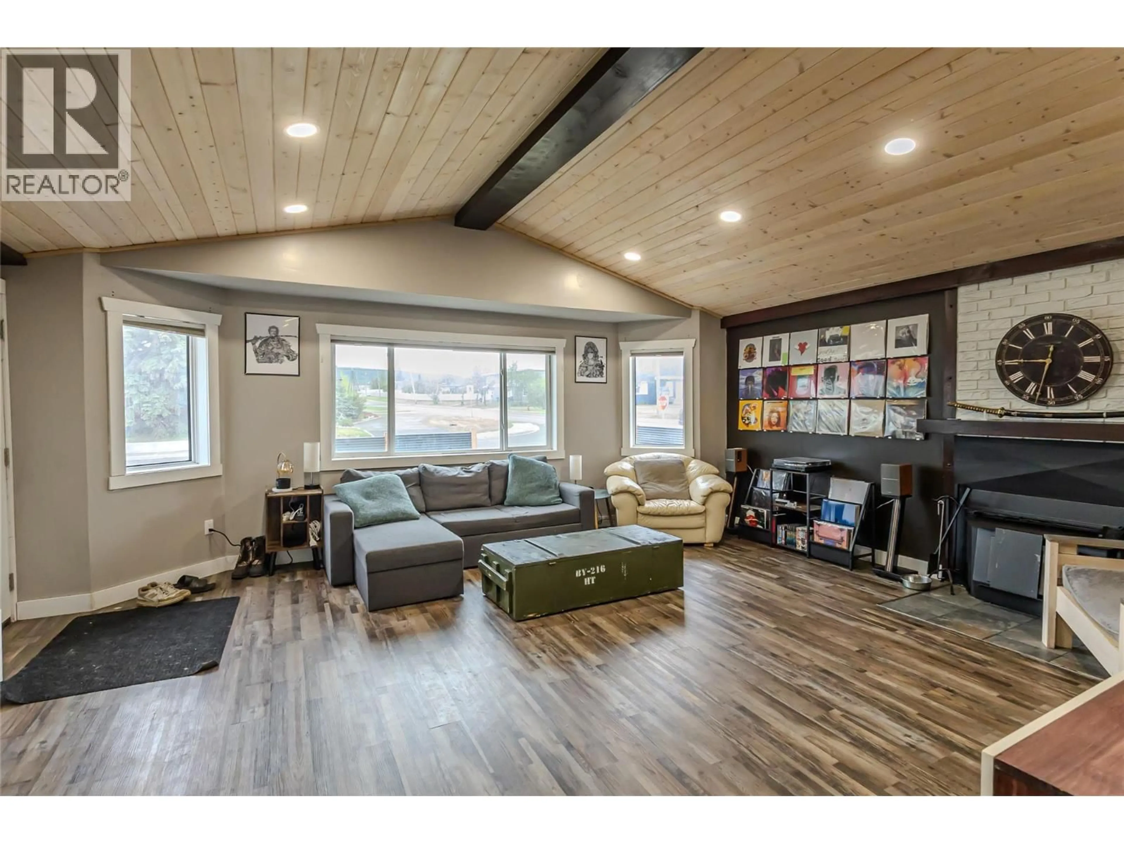 Living room with furniture, wood/laminate floor for 1564 109 AVENUE, Dawson Creek British Columbia V1G2V2