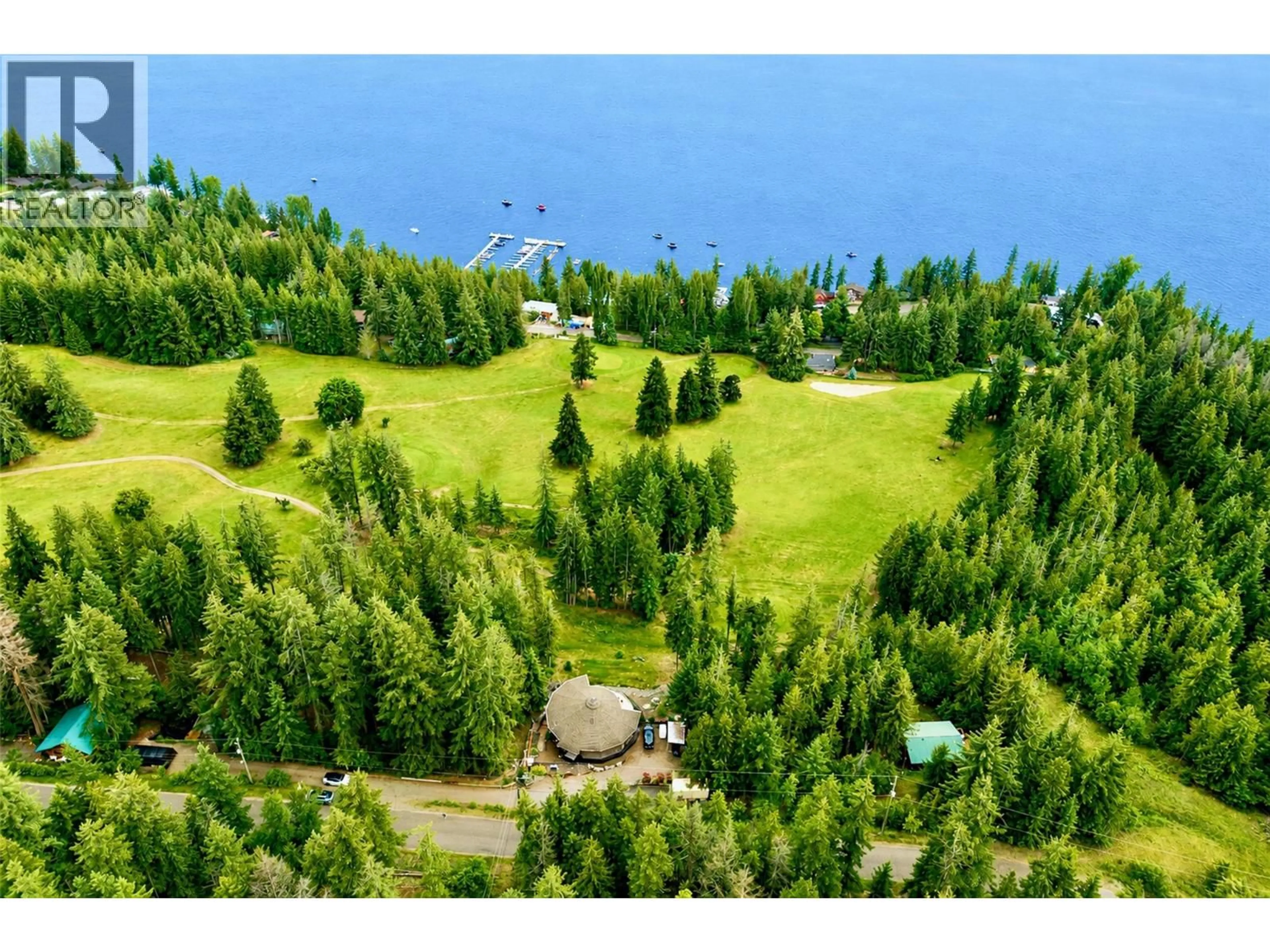 A pic from outside/outdoor area/front of a property/back of a property/a pic from drone, water/lake/river/ocean view for 7712 COLUMBIA DRIVE, Anglemont British Columbia V0E1M8
