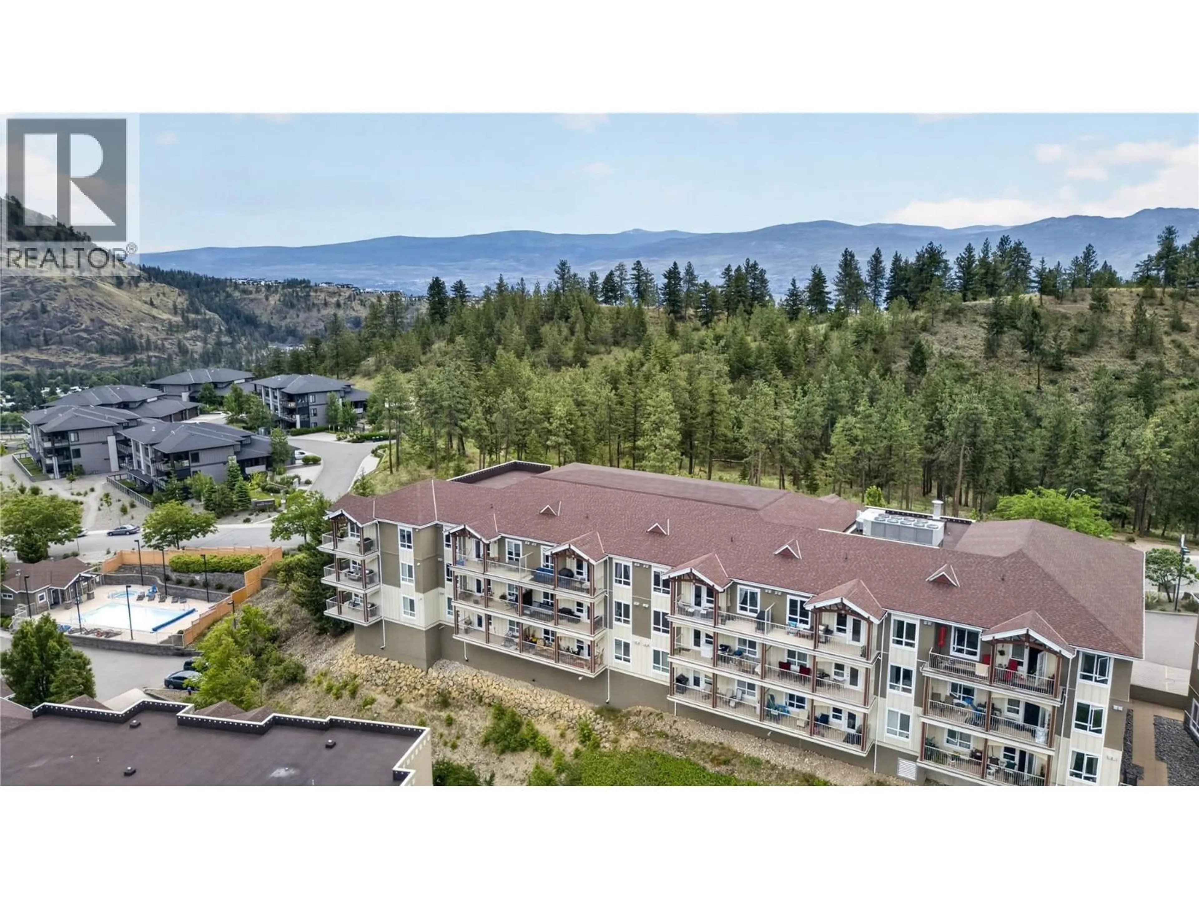 A pic from outside/outdoor area/front of a property/back of a property/a pic from drone, mountain view for 2201-2200 UPPER SUNDANCE DRIVE, West Kelowna British Columbia V4T3E8