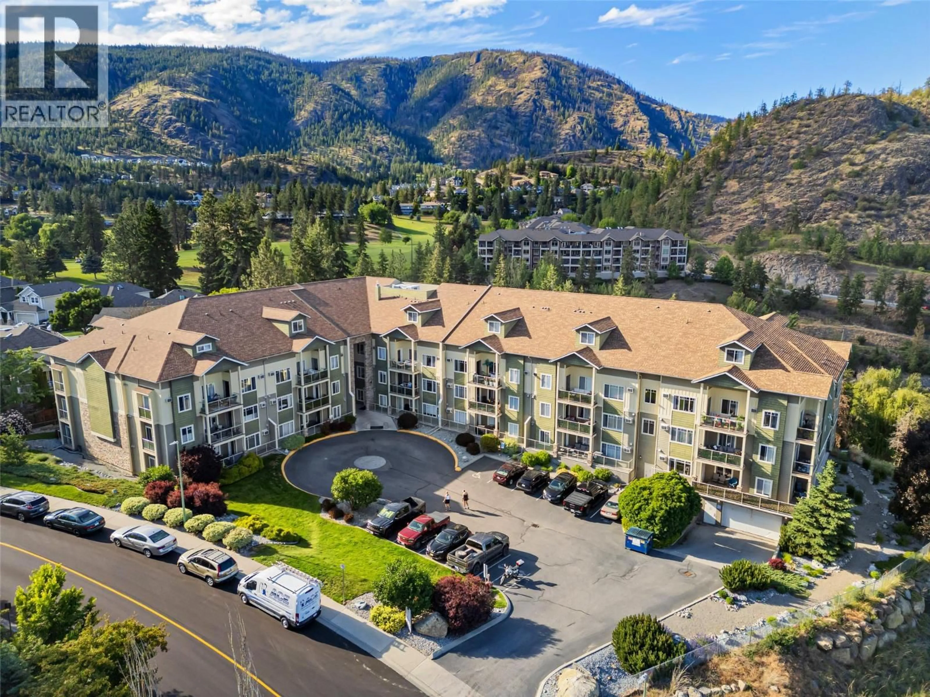 A pic from outside/outdoor area/front of a property/back of a property/a pic from drone, mountain view for 110 - 2120 SHANNON RIDGE DRIVE, West Kelowna British Columbia V4T2Z3
