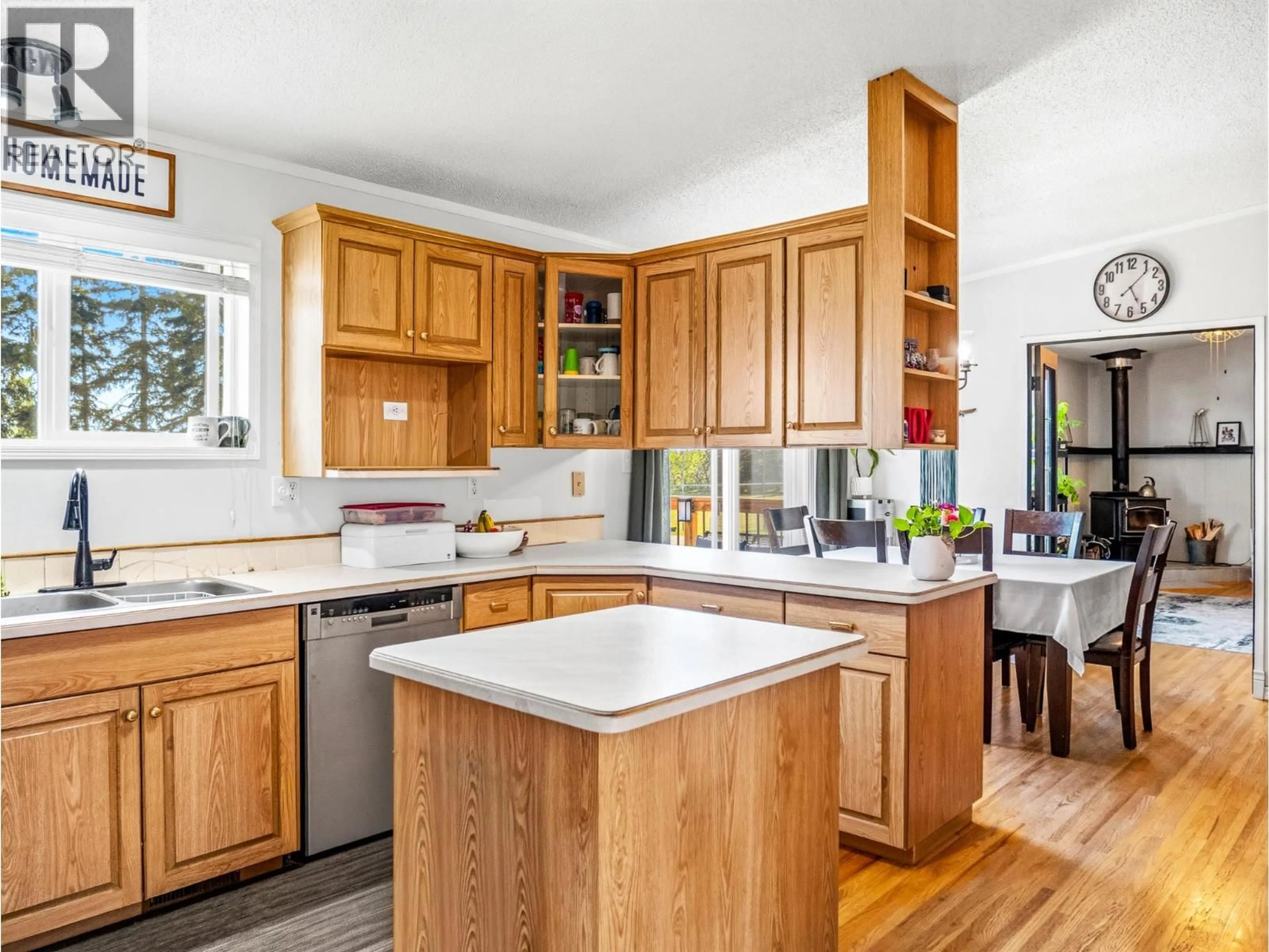 Open concept kitchen, wood/laminate floor for 633 404 AVENUE, Rolla British Columbia V0C2G0