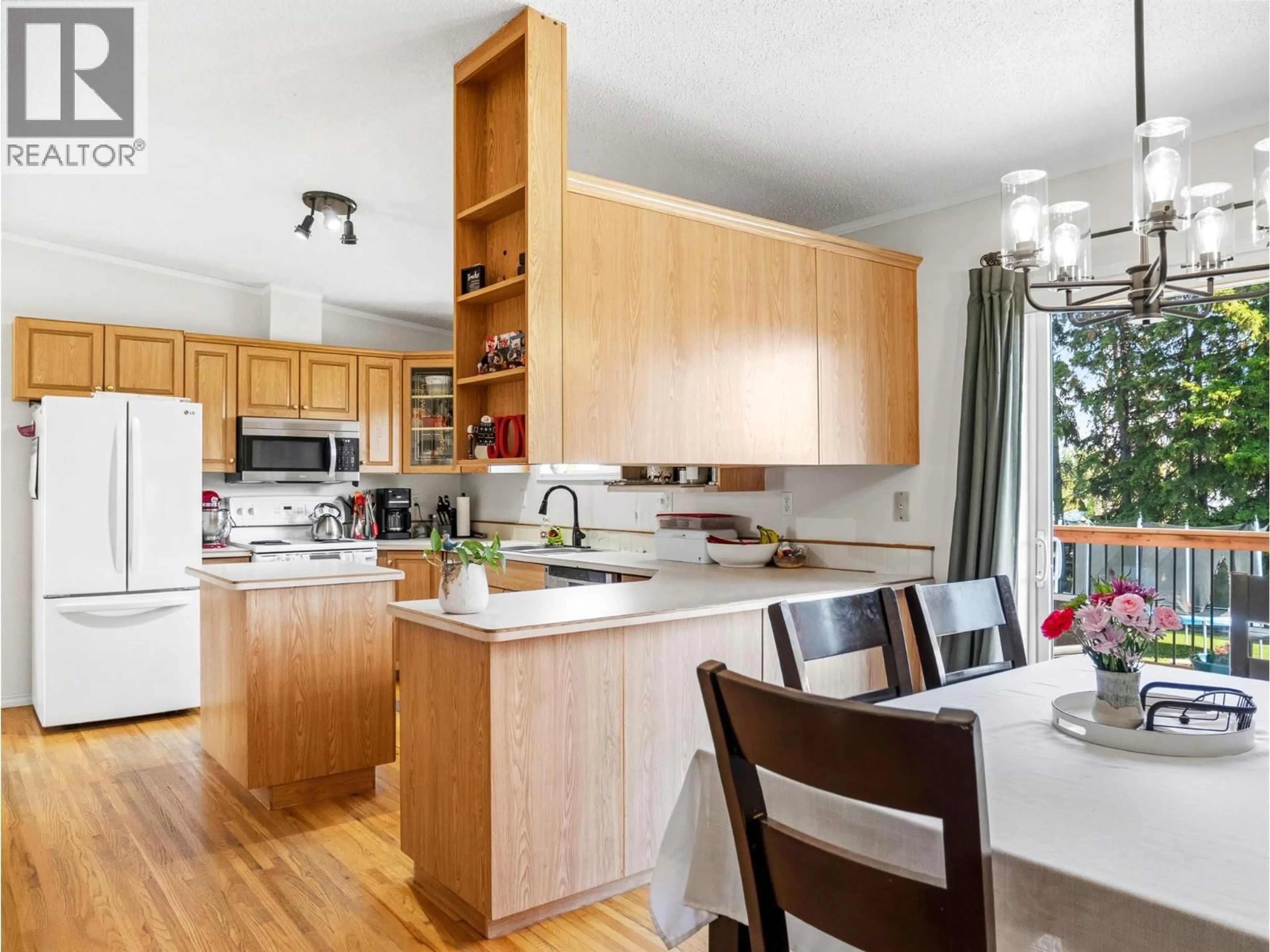 Open concept kitchen, wood/laminate floor for 633 404 AVENUE, Rolla British Columbia V0C2G0