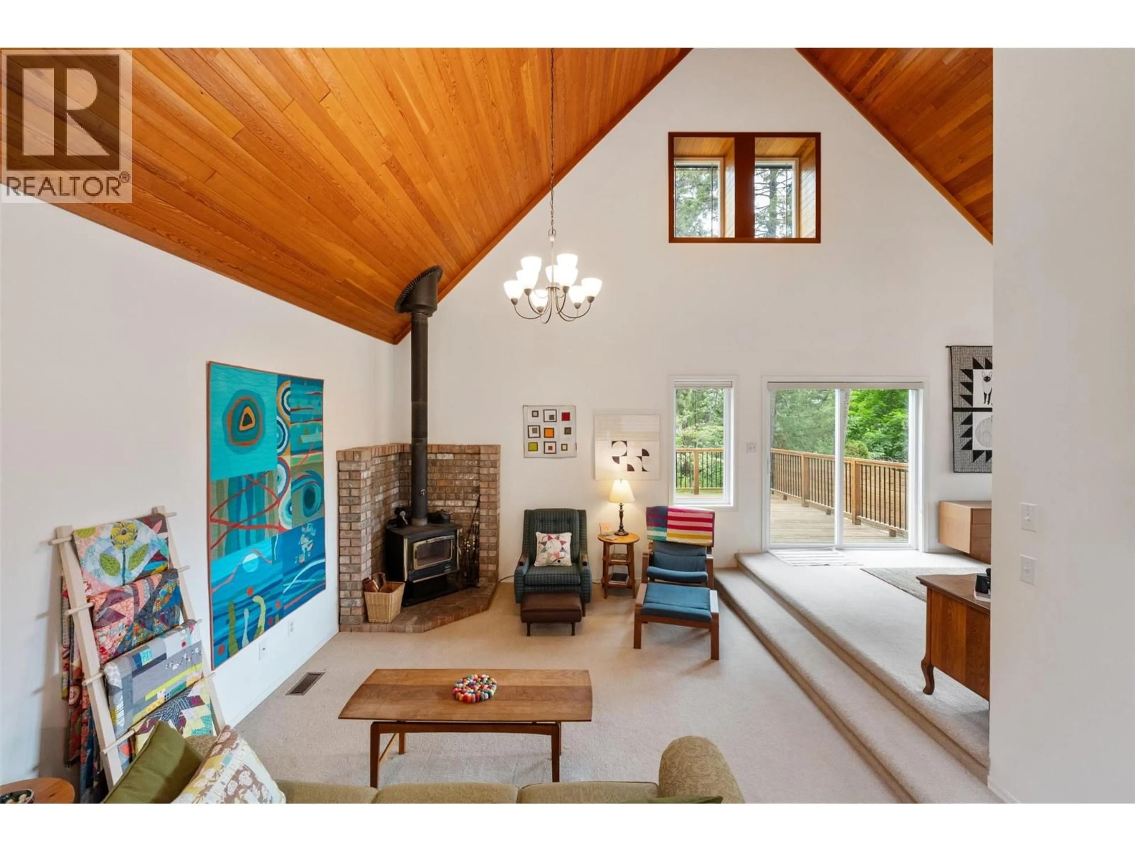 Living room with furniture, wood/laminate floor for 3070 DEBECK ROAD, Naramata British Columbia V0H1N1