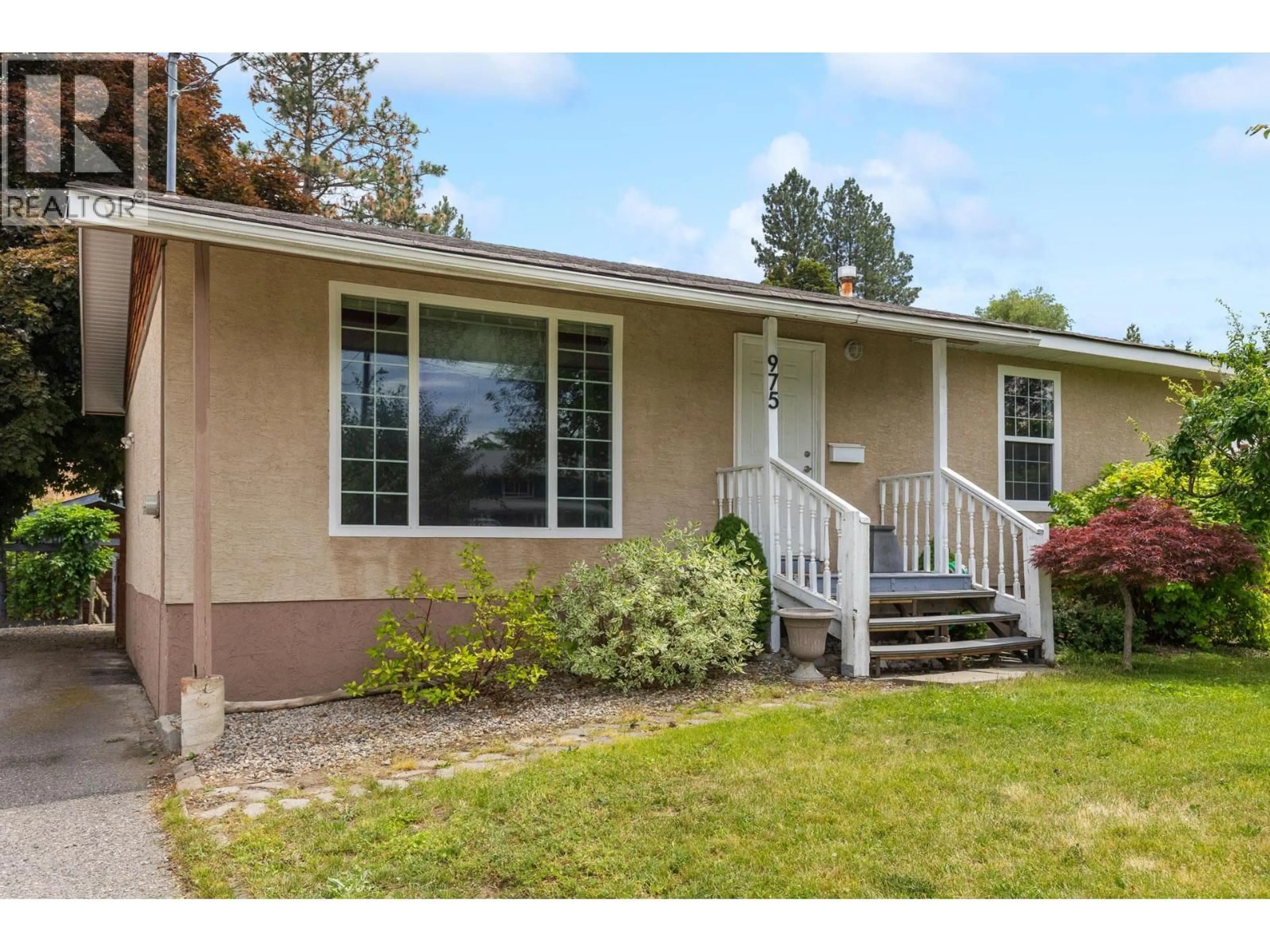 Home with vinyl exterior material, street for 975 NEPTUNE ROAD, Kelowna British Columbia V1X3E4