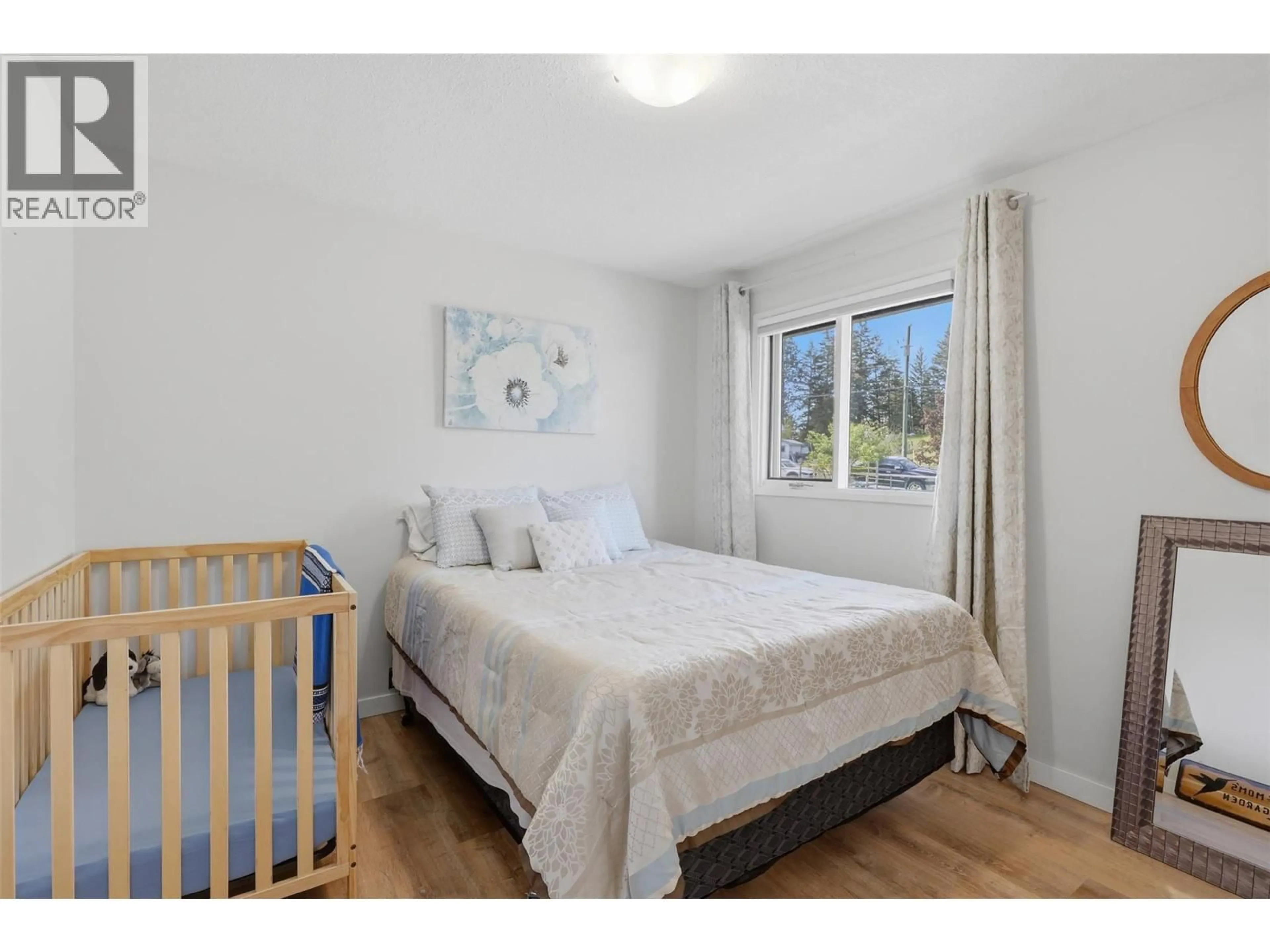 Bedroom with bed, wood/laminate floor for 2015 PRATT ROAD, Kamloops British Columbia V2C5Z7
